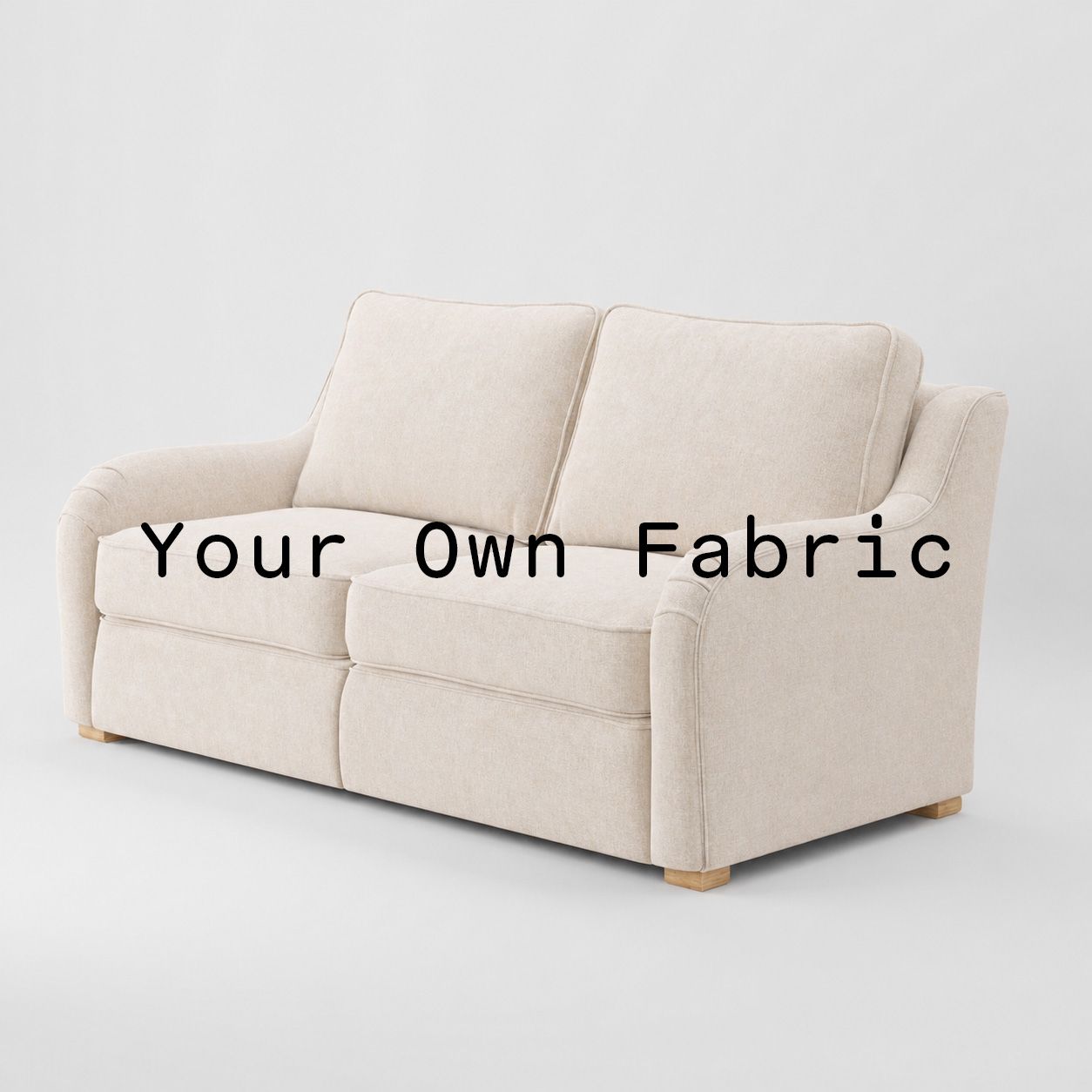Diagonal view of the Cashel sofa upholstered in customers own material calico cotton fabric.