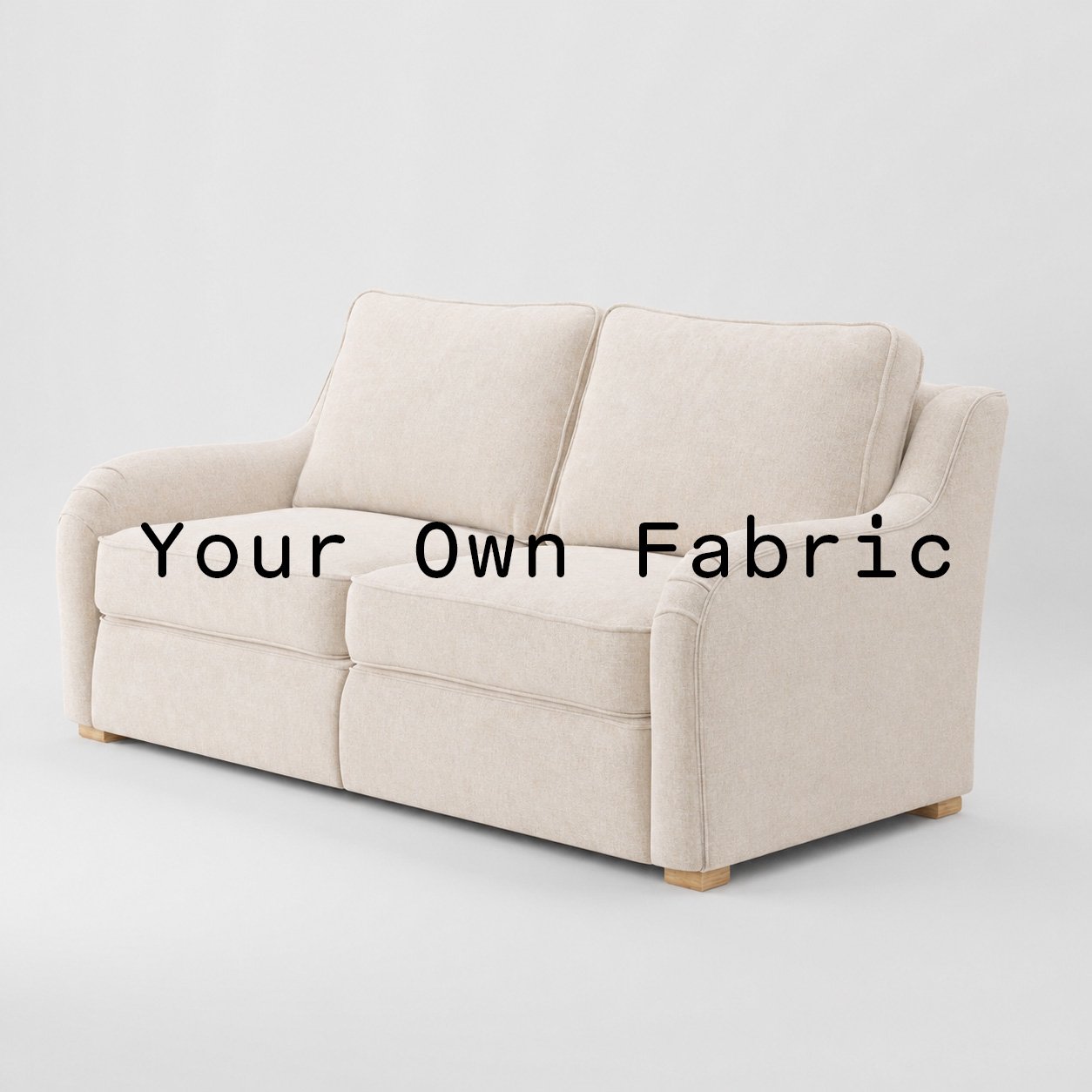 Diagonal view of the Cashel sofa upholstered in customers own material calico cotton fabric.