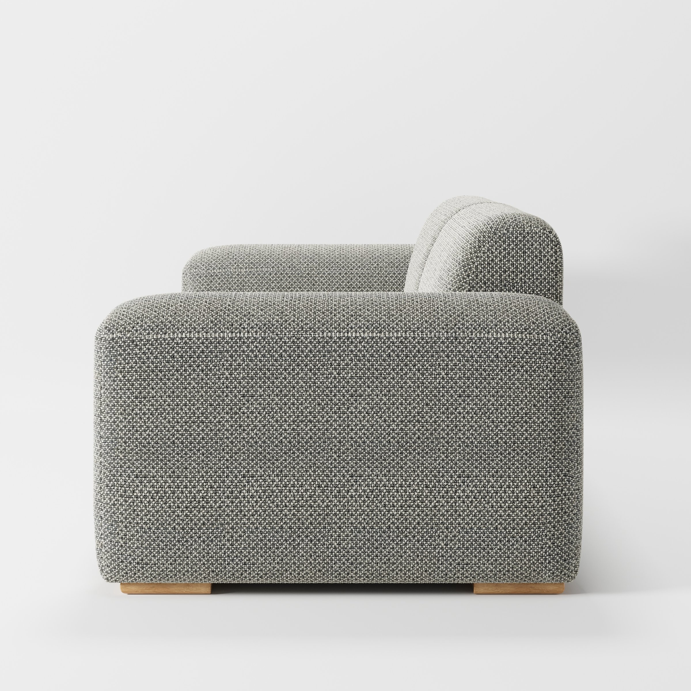 Darwell sofa in Rousay Wool Blend Tar and Chalk shown in side profile displaying proportions and overall silhouette.