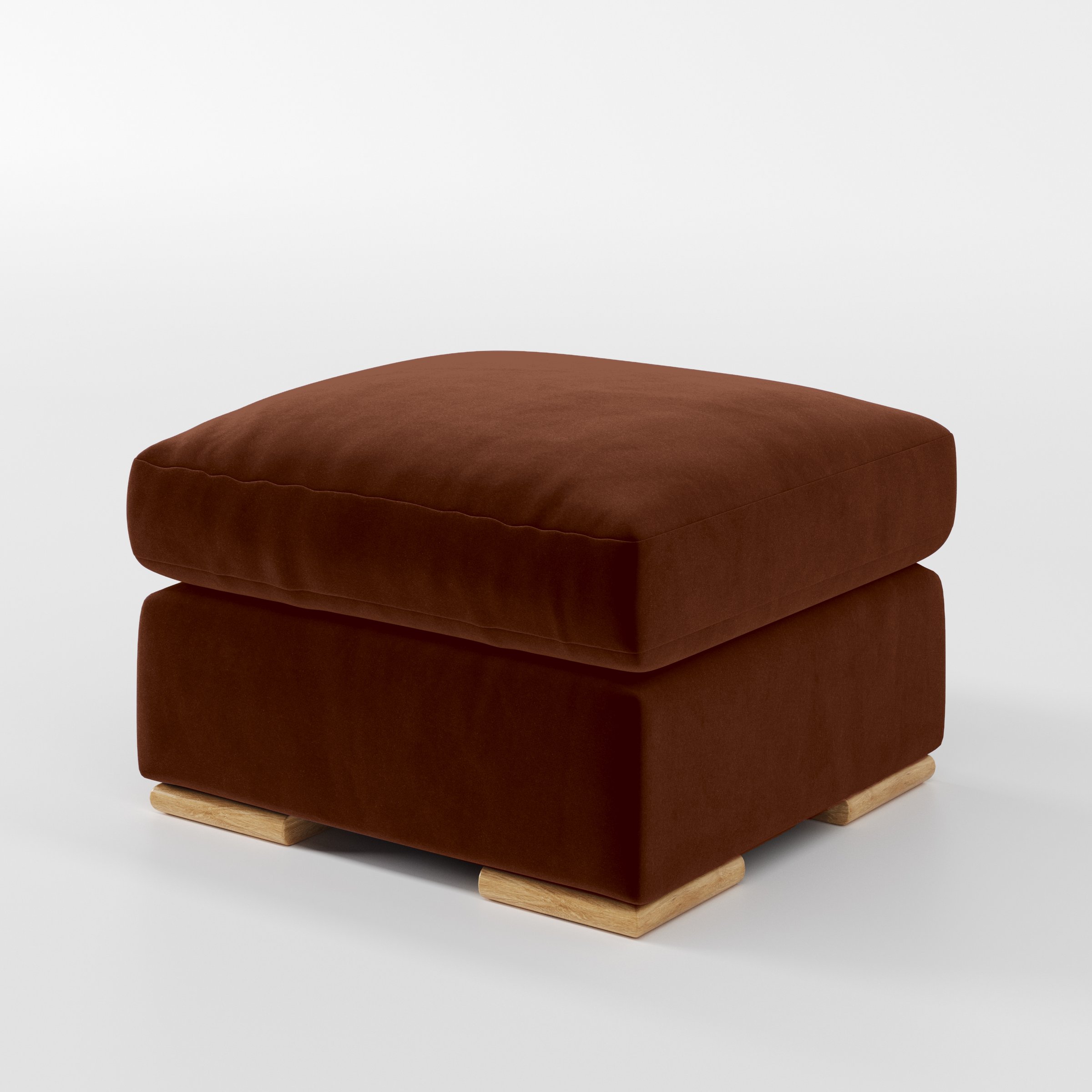 Diagonal view of the Fane footstool upholstered in Plush EasyClean Velvet in Maple.