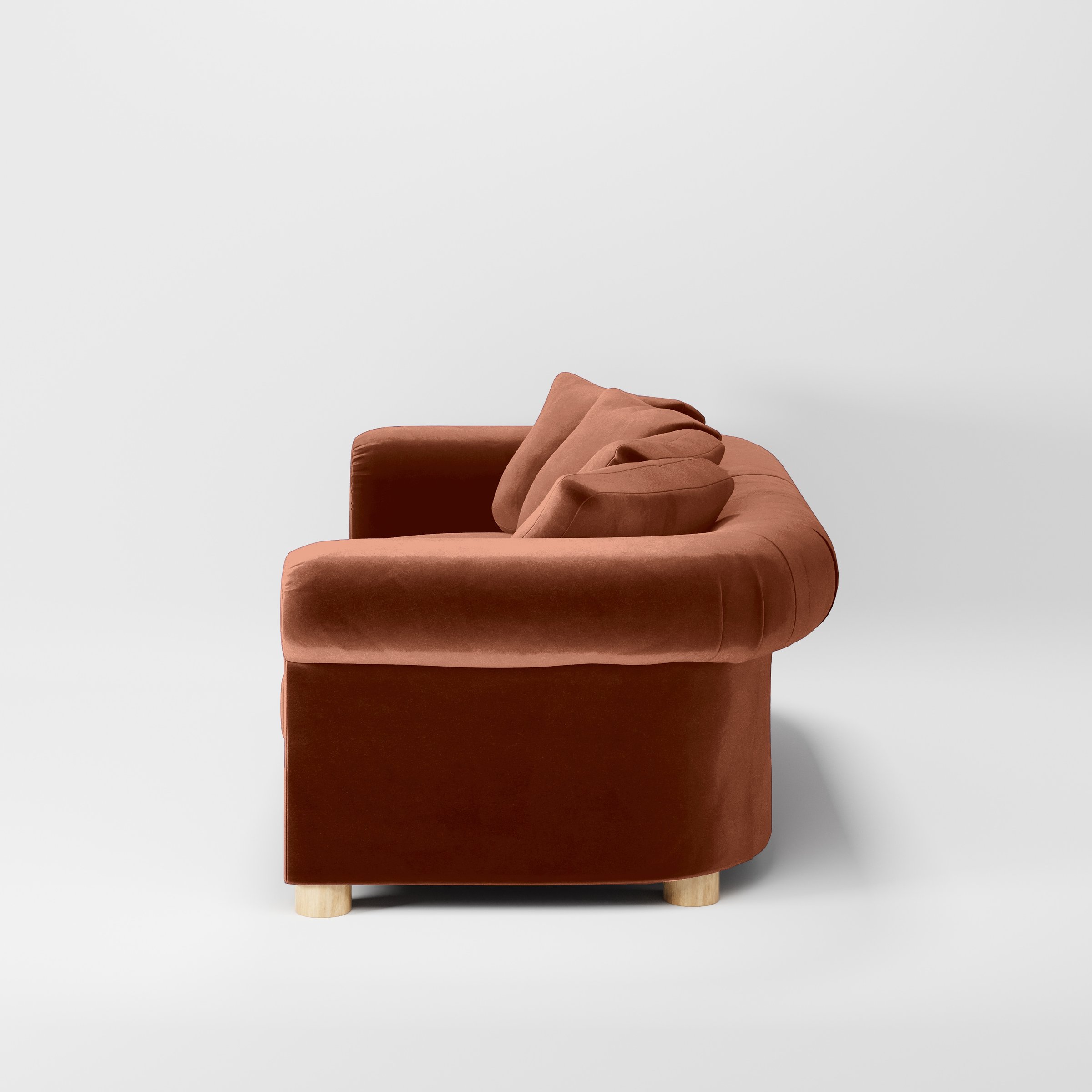 Side view of the Windermere sofa upholstered in Plush EasyClean Velvet in Apricot.