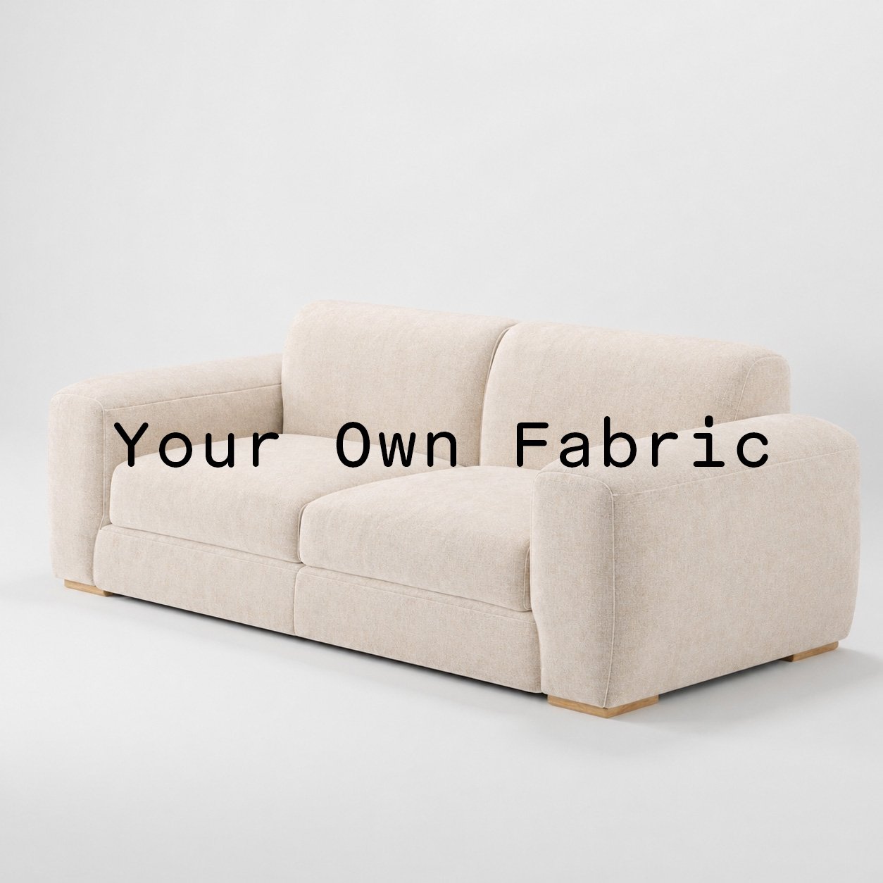 Diagonal view of the Darwell sofa upholstered in customers own material calico cotton fabric.