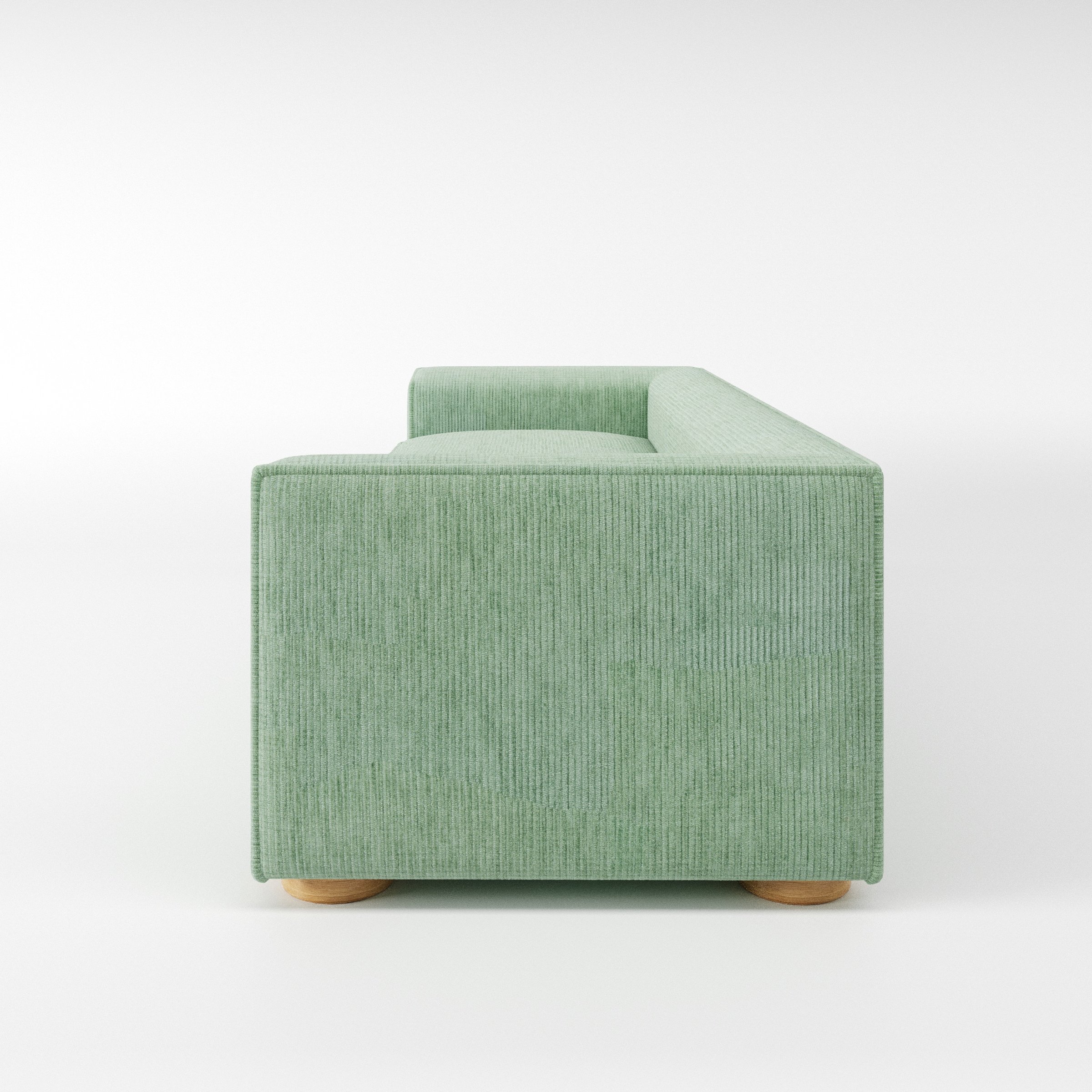 Feale sofa in Caldey Velvet Corduroy Eucalyptus shown in side profile displaying proportions and overall silhouette.