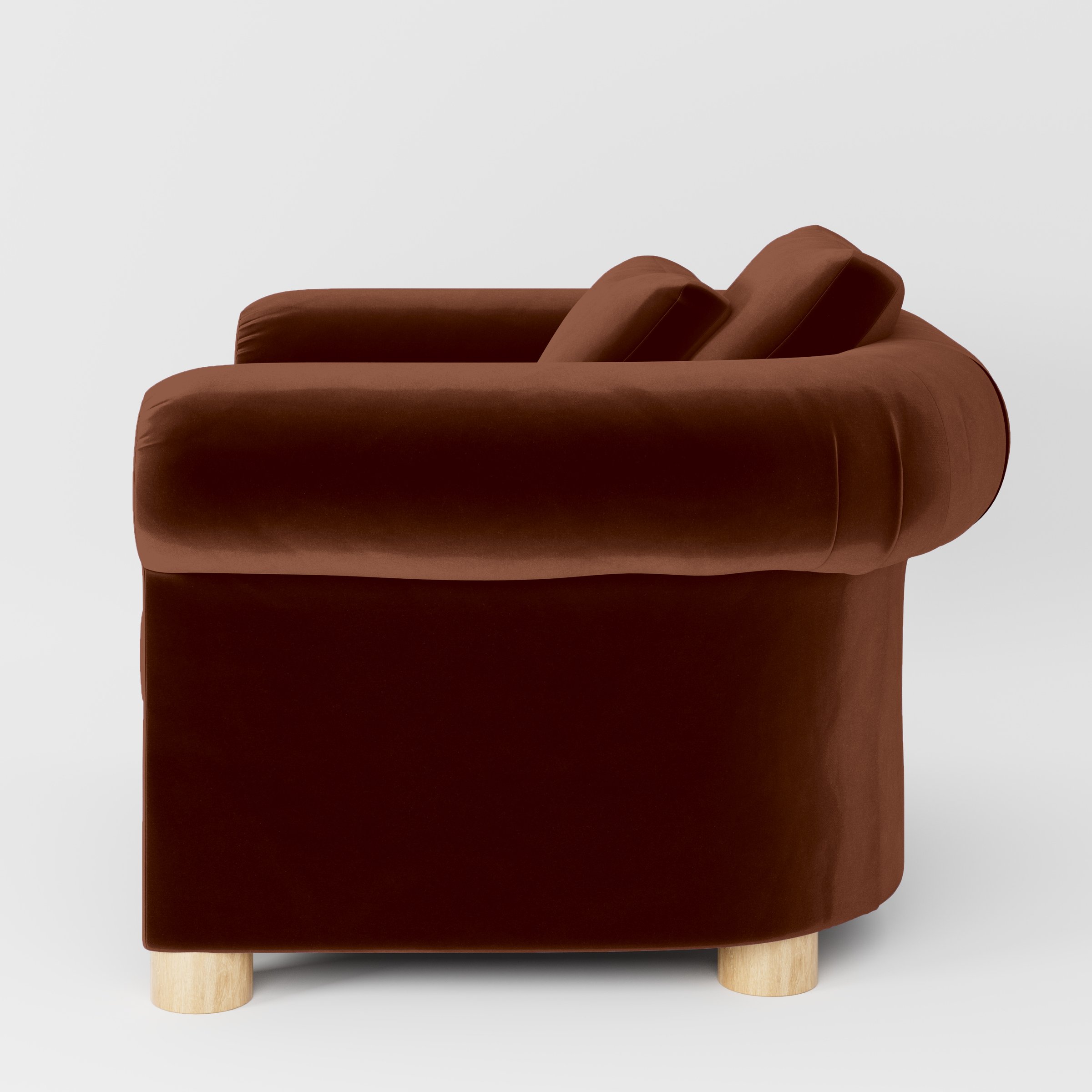 Side view of the Windermere armchair upholstered in Plush EasyClean Velvet in Maple.
