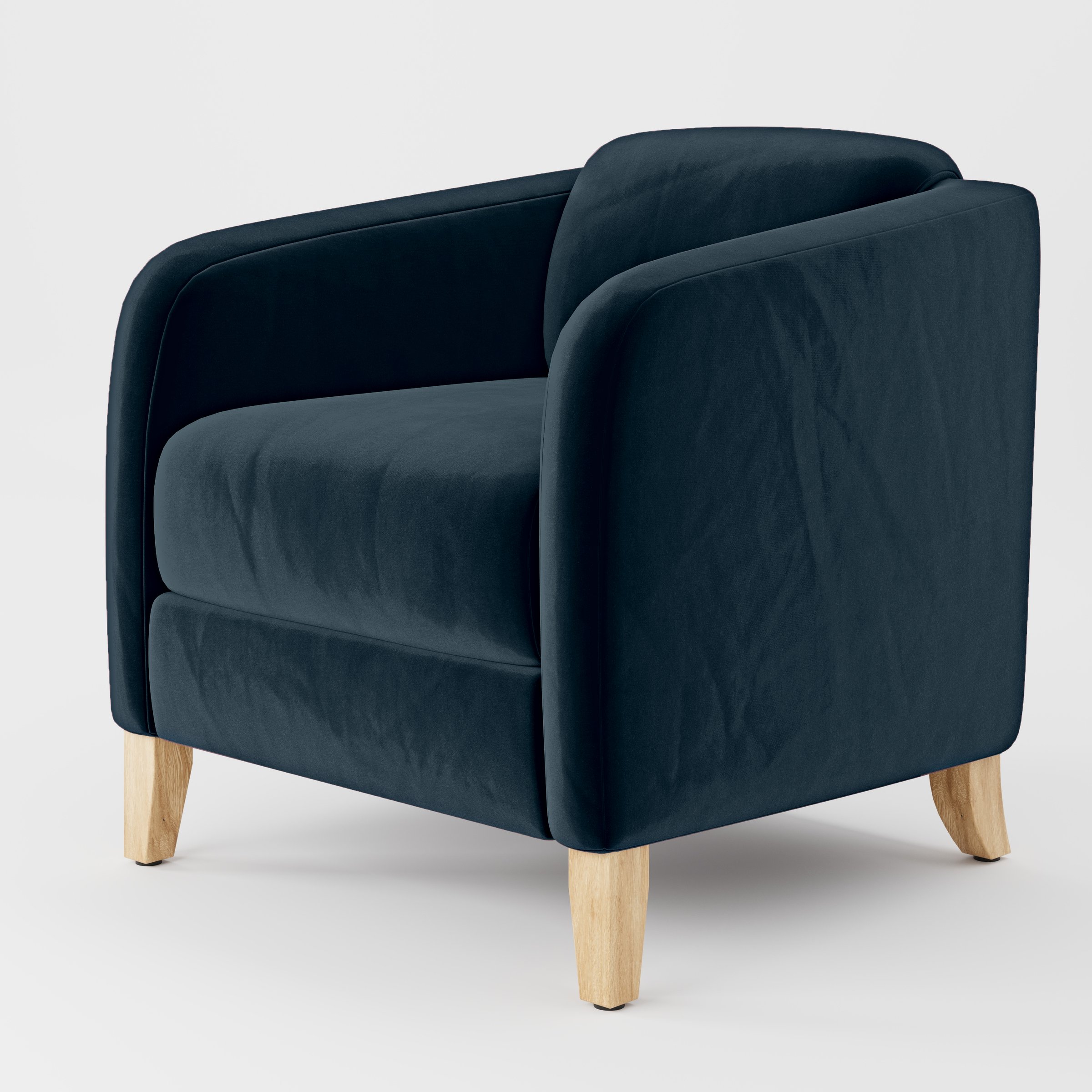 Diagonal view of the Erne armchair upholstered in Plush EasyClean Velvet in Navy.