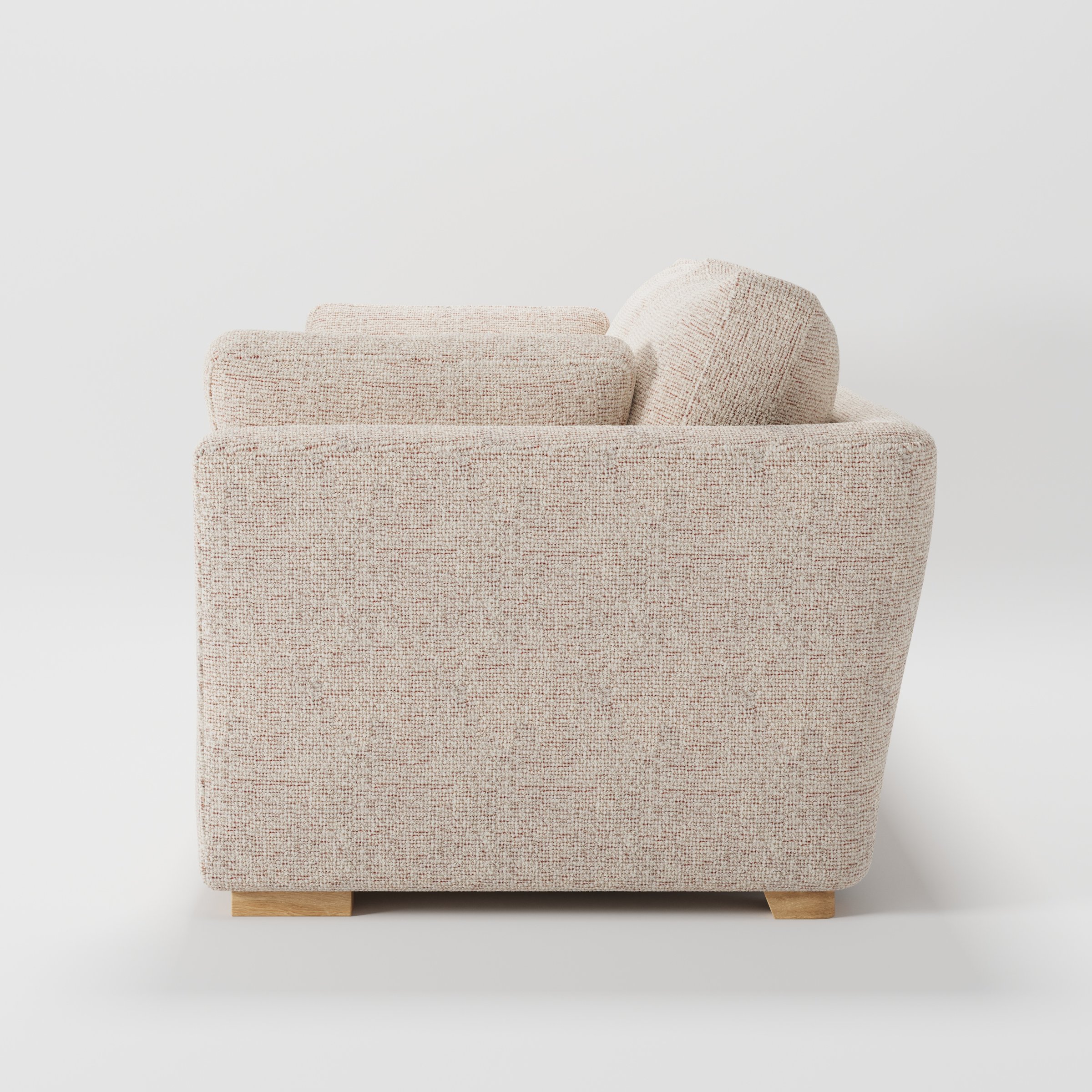 Stowe sofa in Orsay Boucle Cream and Copper shown in side profile displaying proportions and overall silhouette.