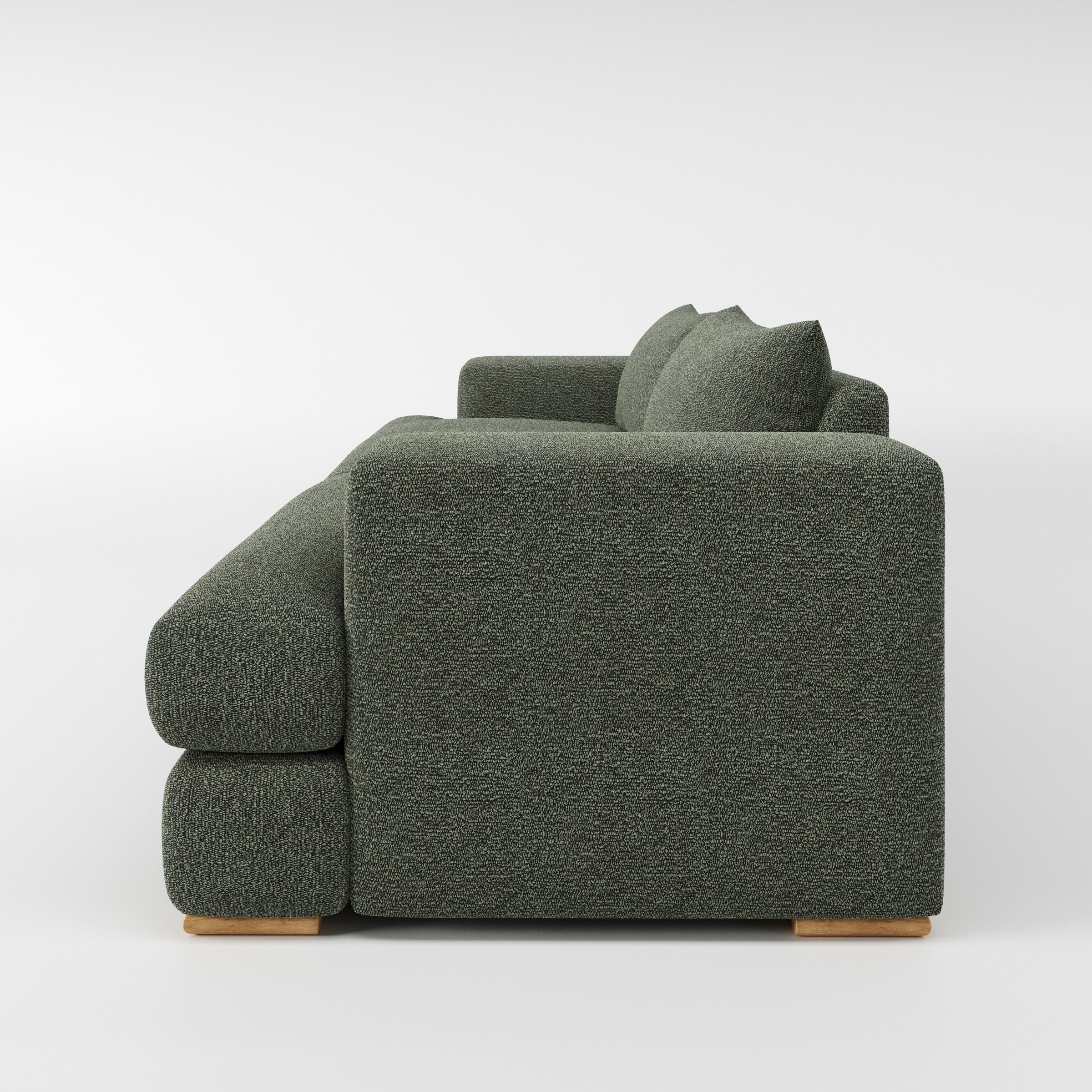 Fane sofa in Kilda Boucle Moss shown in side profile displaying proportions and overall silhouette.