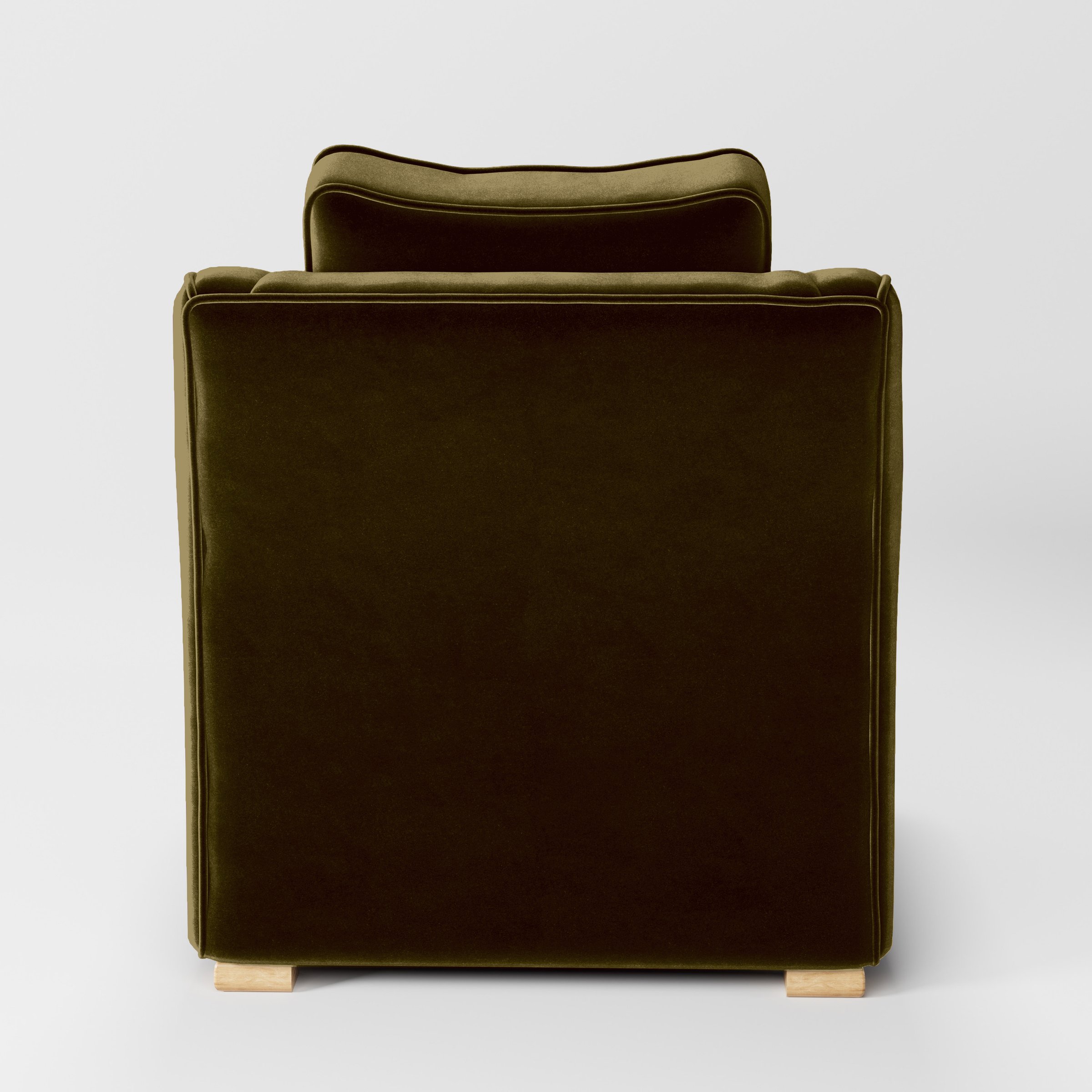 Rear view of the Cashel armchair upholstered in Plush EasyClean Velvet in Cedar.