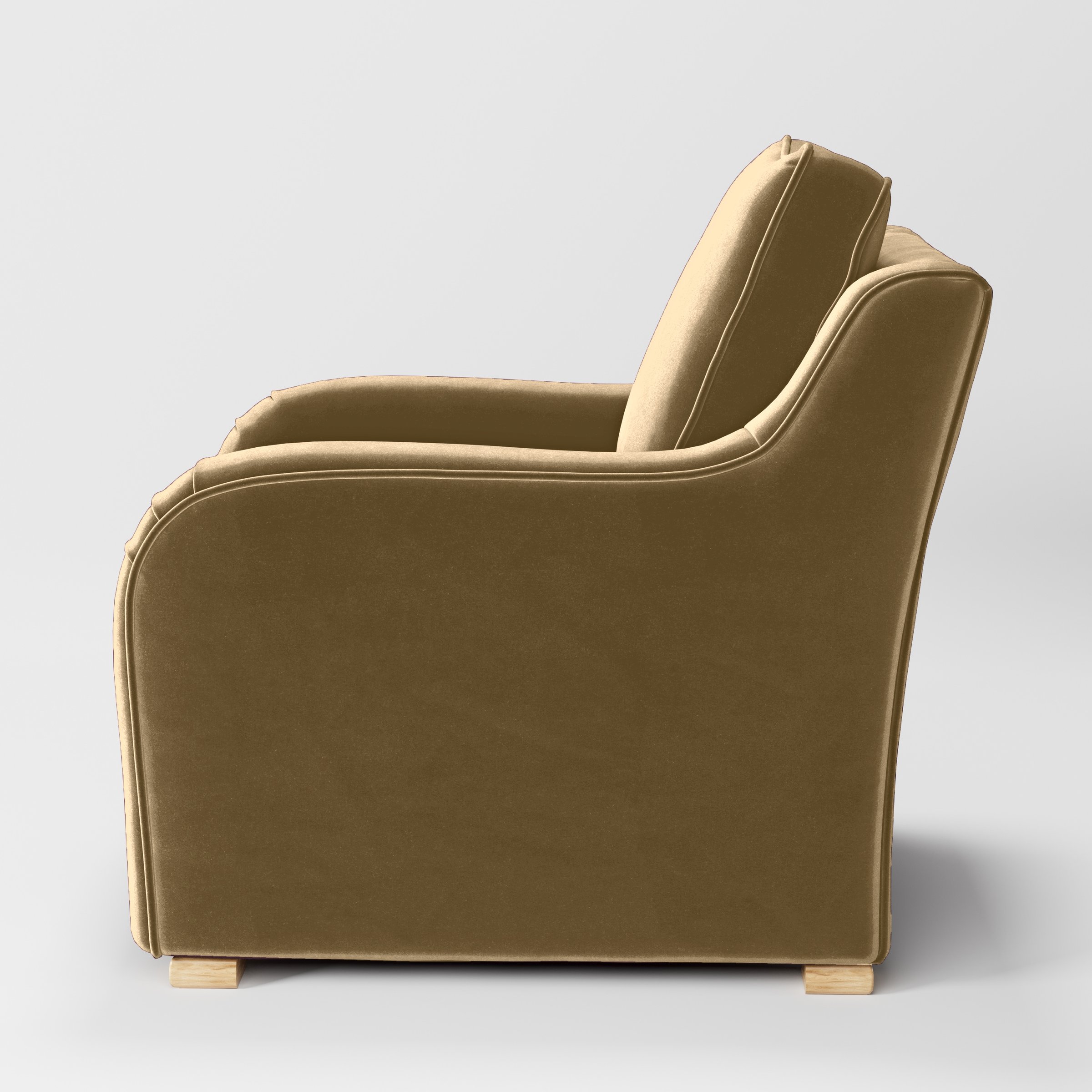 Side view of the Cashel armchair upholstered in Plush EasyClean Velvet in Cafe.