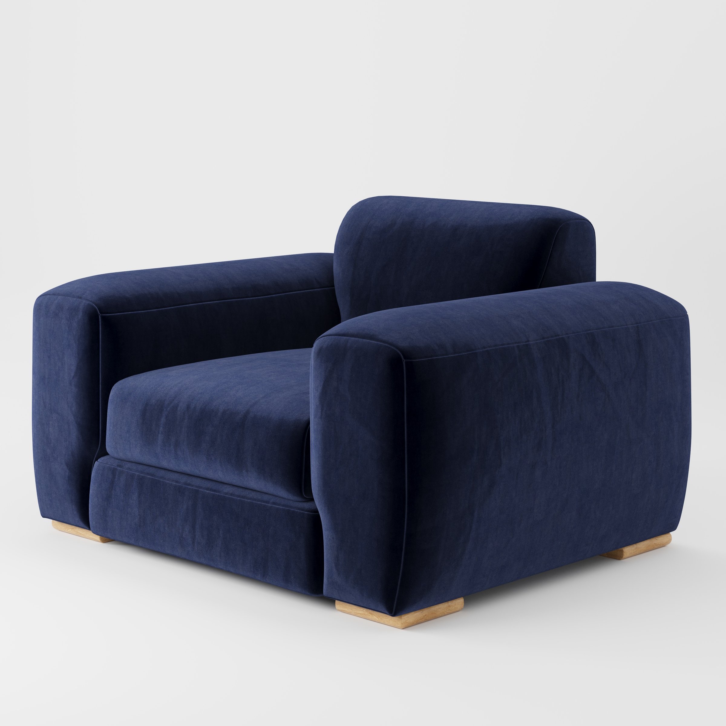 Darwell armchair in Noss Velvet Navy shown at a diagonal angle highlighting arms and seat depth.