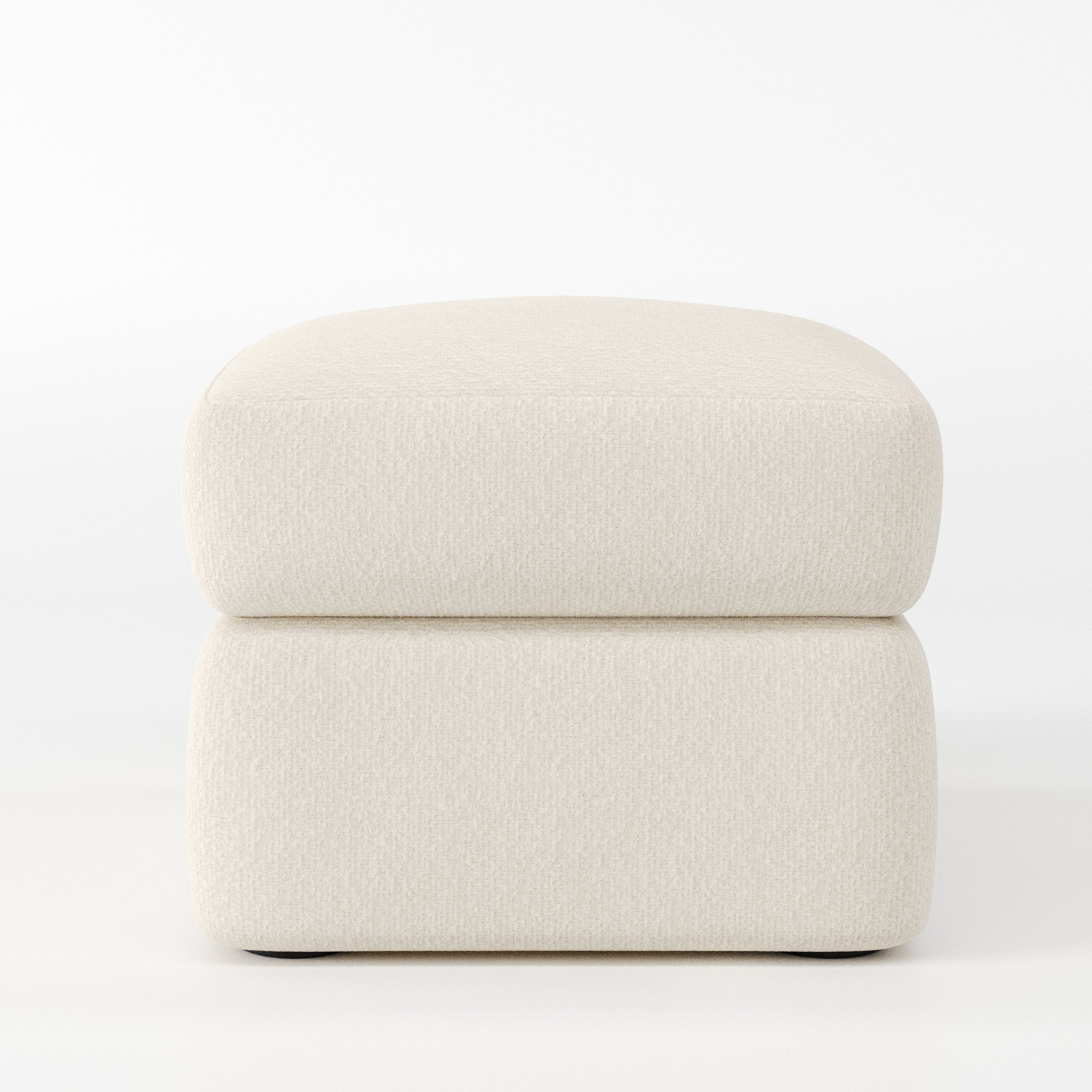 Coniston footstool in Kilda Boucle Cream shown front-on against a neutral studio backdrop.
