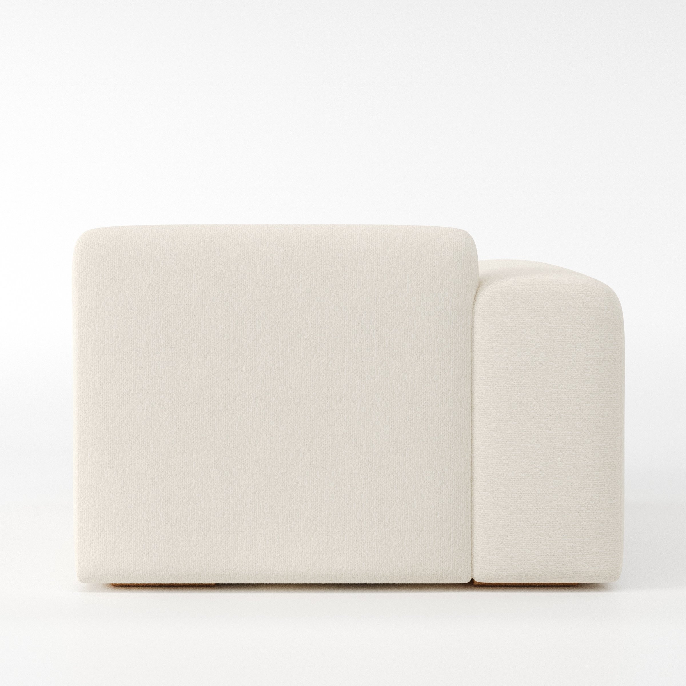 Drumquin modular sofa left side unit in Kilda Bouclé Cream shown from the back with a smooth, softly curved silhouette and armrest edge visible.