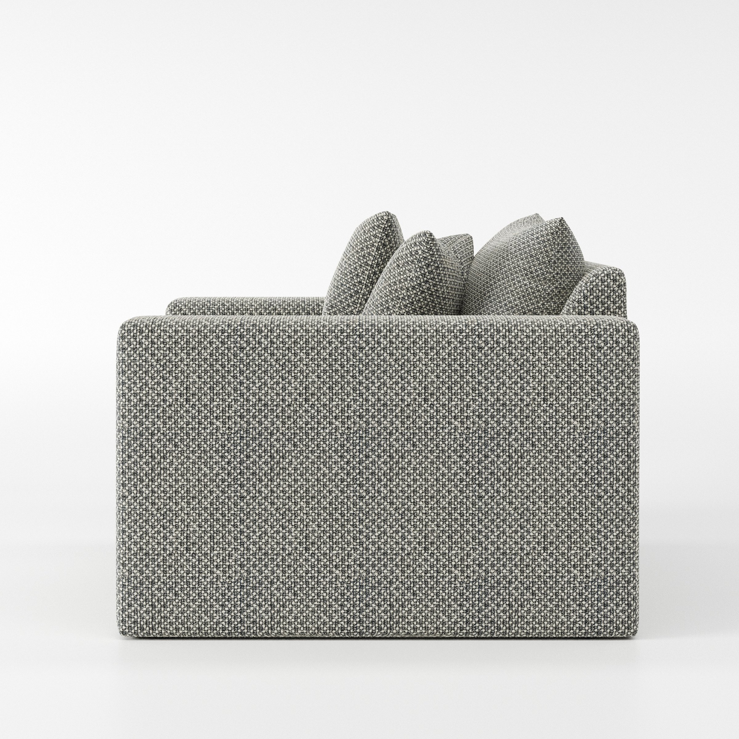 Coniston armchair in Rousay Wool Blend Tar and Chalk shown in side profile displaying proportions and overall silhouette.