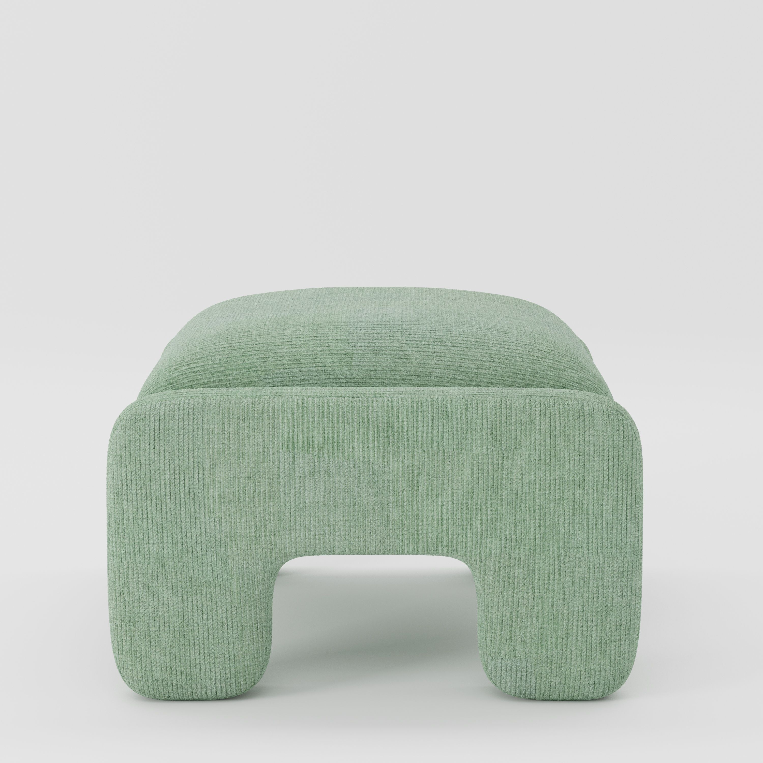 Inny footstool in Caldey velvet corduroy eucalyptus fabric, side view emphasising rounded edges and continuous upholstery