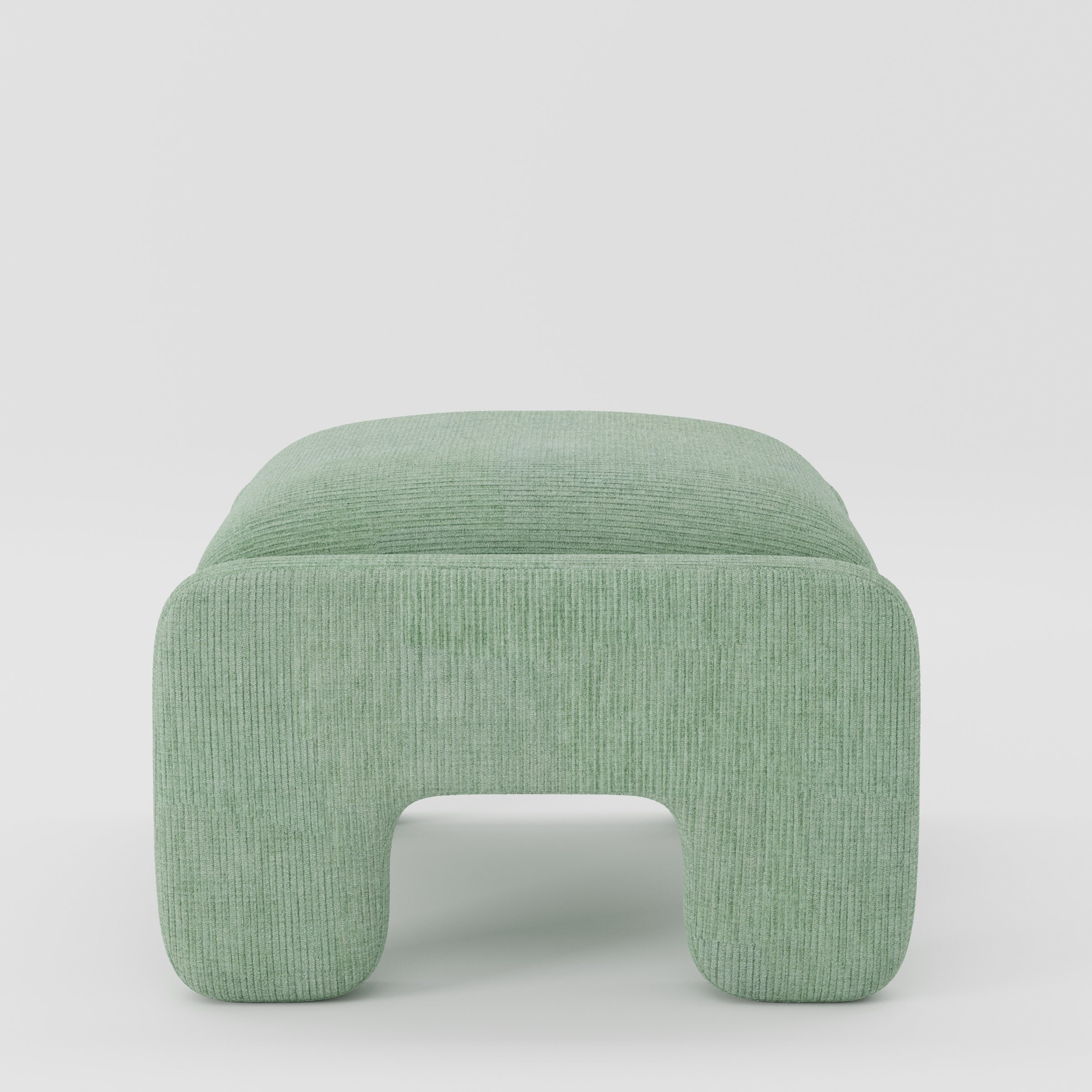 Inny footstool in Caldey velvet corduroy eucalyptus fabric, side view emphasising rounded edges and continuous upholstery