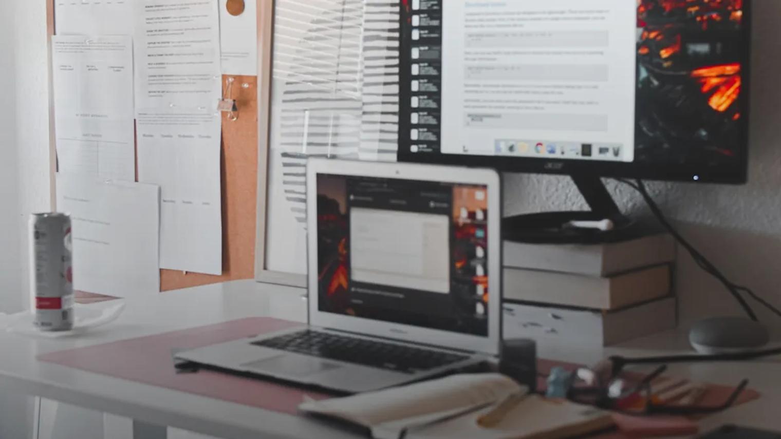 black flat screen computer monitor on white wooden desk