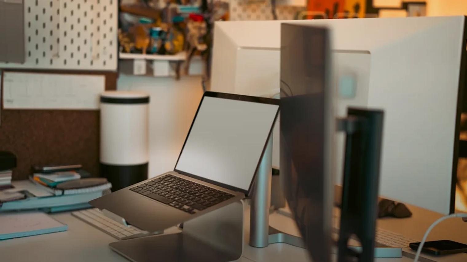 A laptop computer sitting on top of a desk