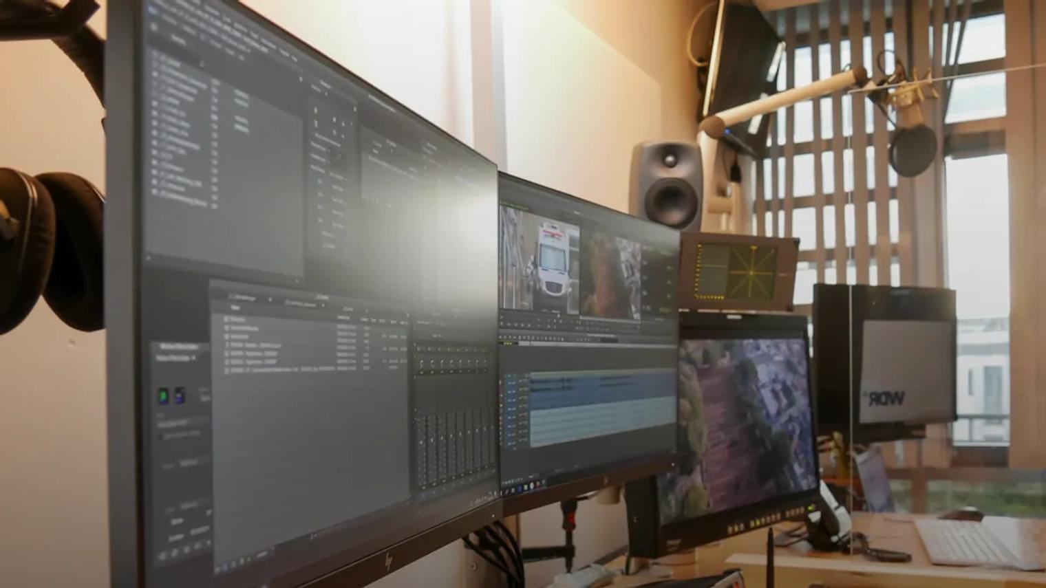 black flat screen computer monitor on brown wooden desk