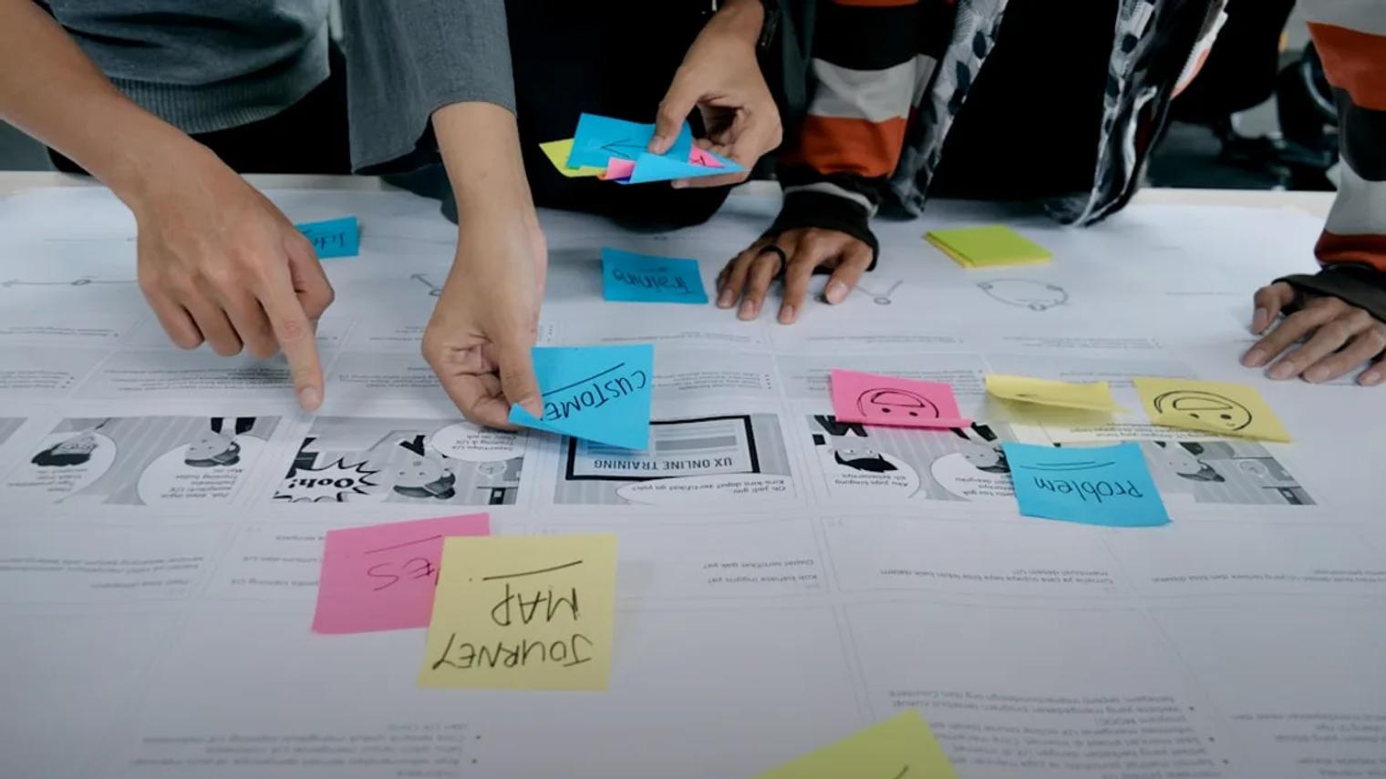 team collaborating with sticky notes