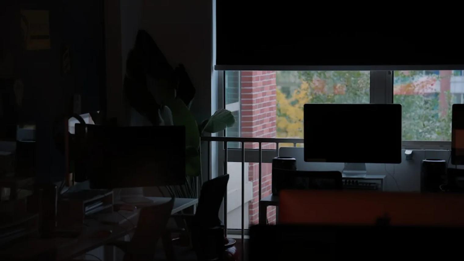 a room with a tv and chairs