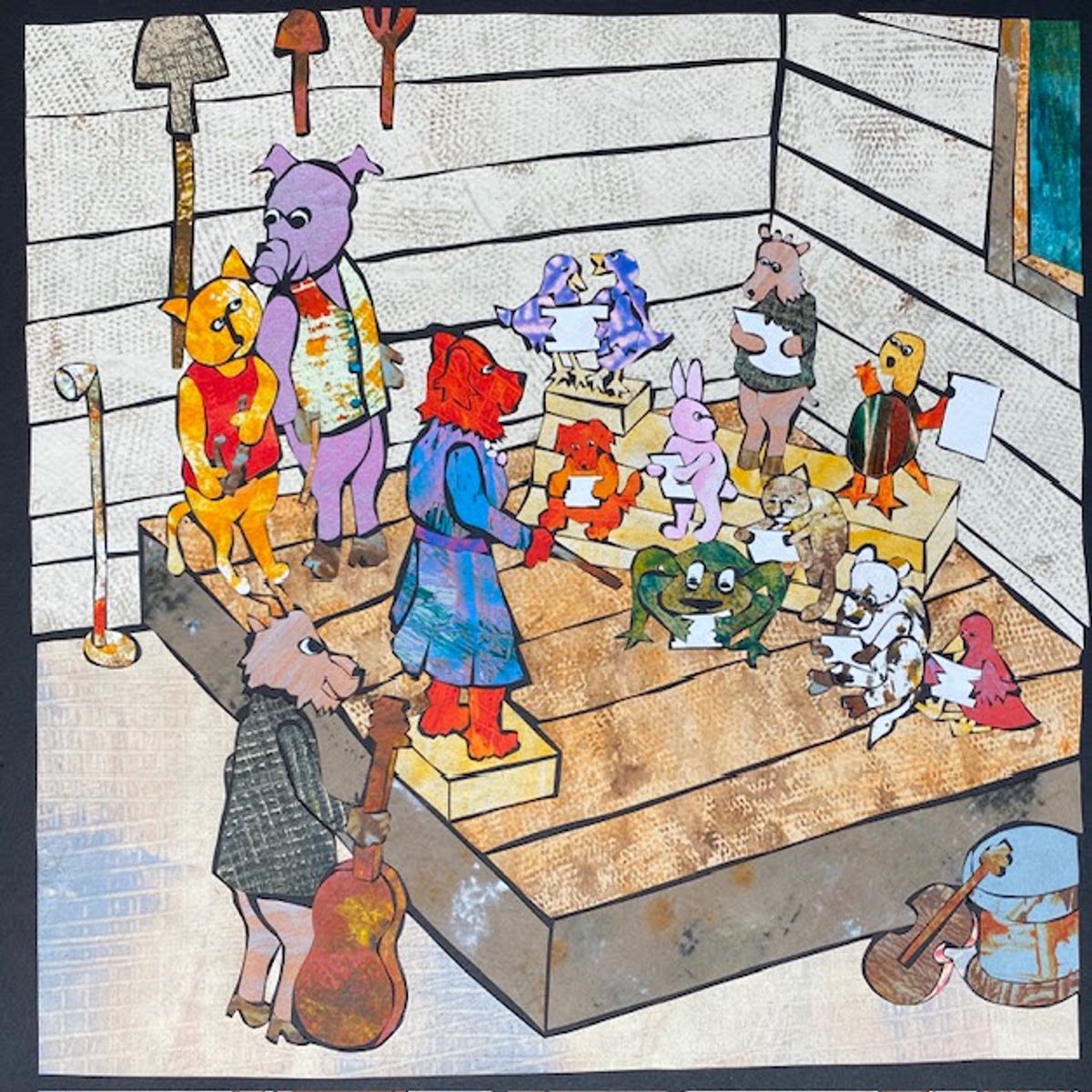 A cut-paper collage of a barn interior. A band of animals — pig, cat, red dog, deer — plays on a raised plank stage while ducks, a rabbit, a frog and a turtle hold sheet music. Tools hang on the whitewashed wall.