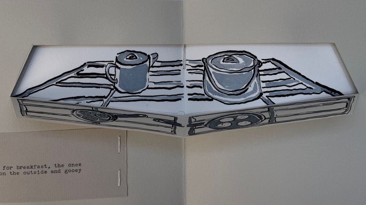 A pop-up spread rising from the gutter: a camp stove drawn in grey wash with a kettle and a lidded pot on its ribbed burners. A typed slip below mentions the ones crisp on the outside and gooey.