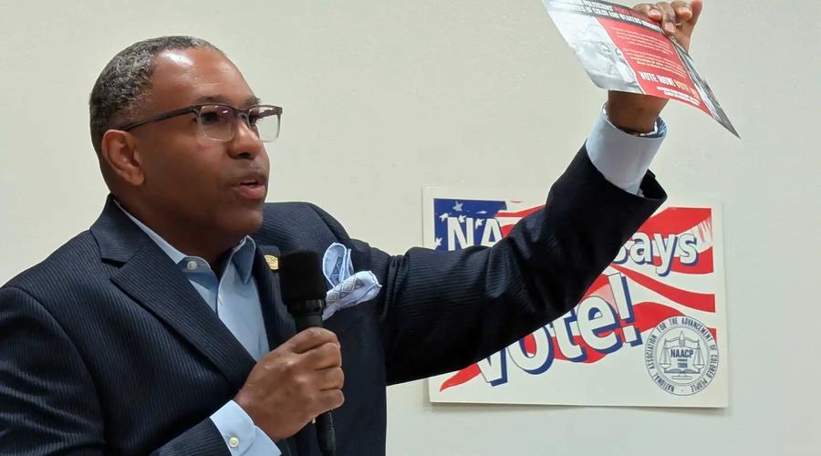 Charles Gates, incoming YJCW NAACP branch president, holds up a flier opposing the upcoming redistricting referendum that he received in the mail on Monday, April 13, 2026.
