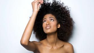model with brown curly hair