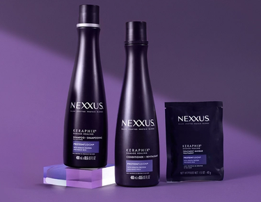The entire Keraphix Keratin Collection is shown against a purple background.