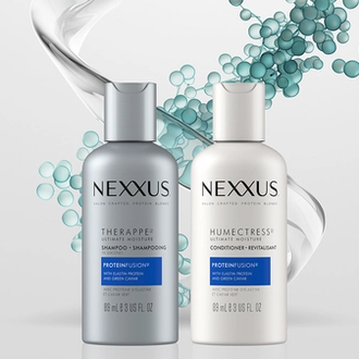 Bottles of Therappe Ultimate Moisture Shampoo and Humectress Ultimate Moisture Conditioner are shown against a white background with droplets and swirls of moisture behind them.