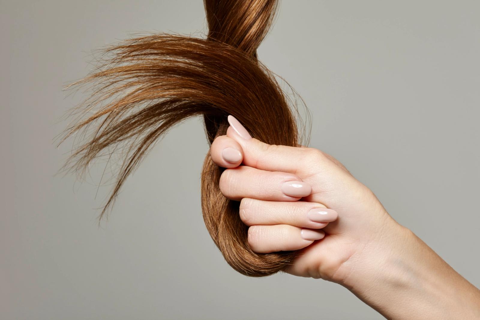 Woman holding her hairs
