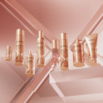 The entire Nexxus Styling Line collection is shown against a shiny, rose-gold background.