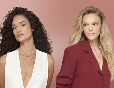 Three models are shown with different hairstyles: one with a sleek updo, one with long curls, and one with long waves. 