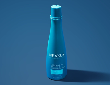 A bottle of Ultralight Smooth Weightless Protection Conditioner is shown against a blue background.