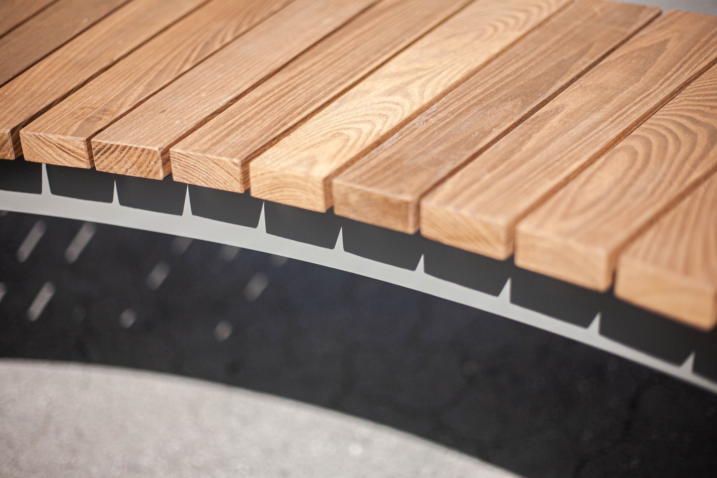 Wood mounted commercial park benches canada designed by site manufacturer, Green Theory.