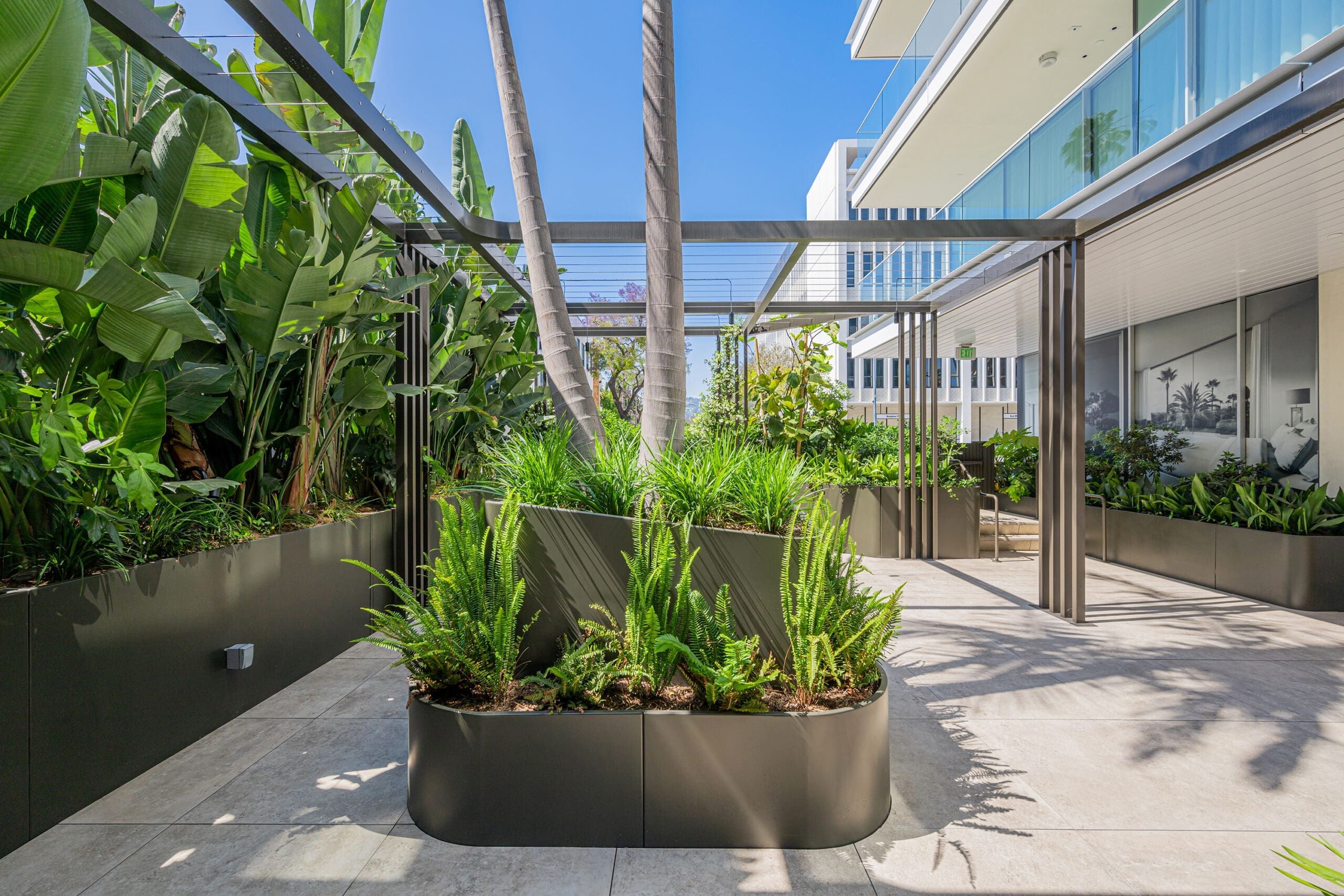 Residential building planters and site furnishings by Green Theory. Customize your commercial planters for your space.