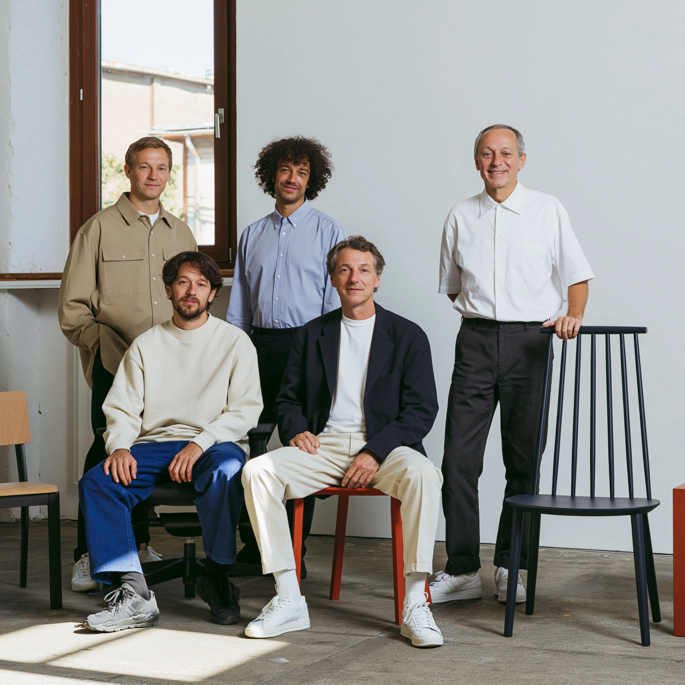 A team comparing furniture options for a workspace brief.
