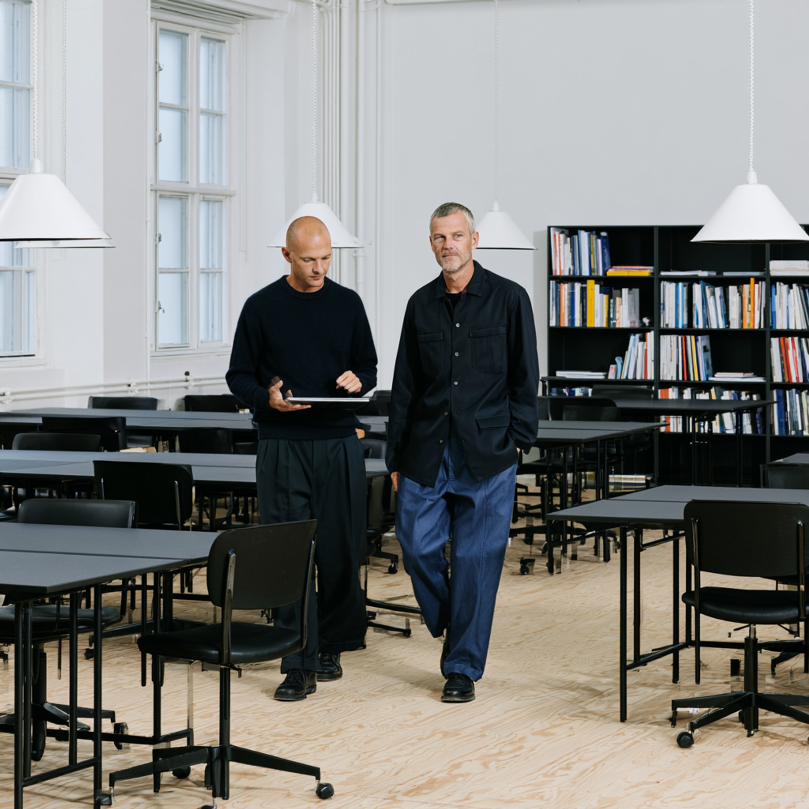 Workplace stakeholders reviewing office furniture decisions together.