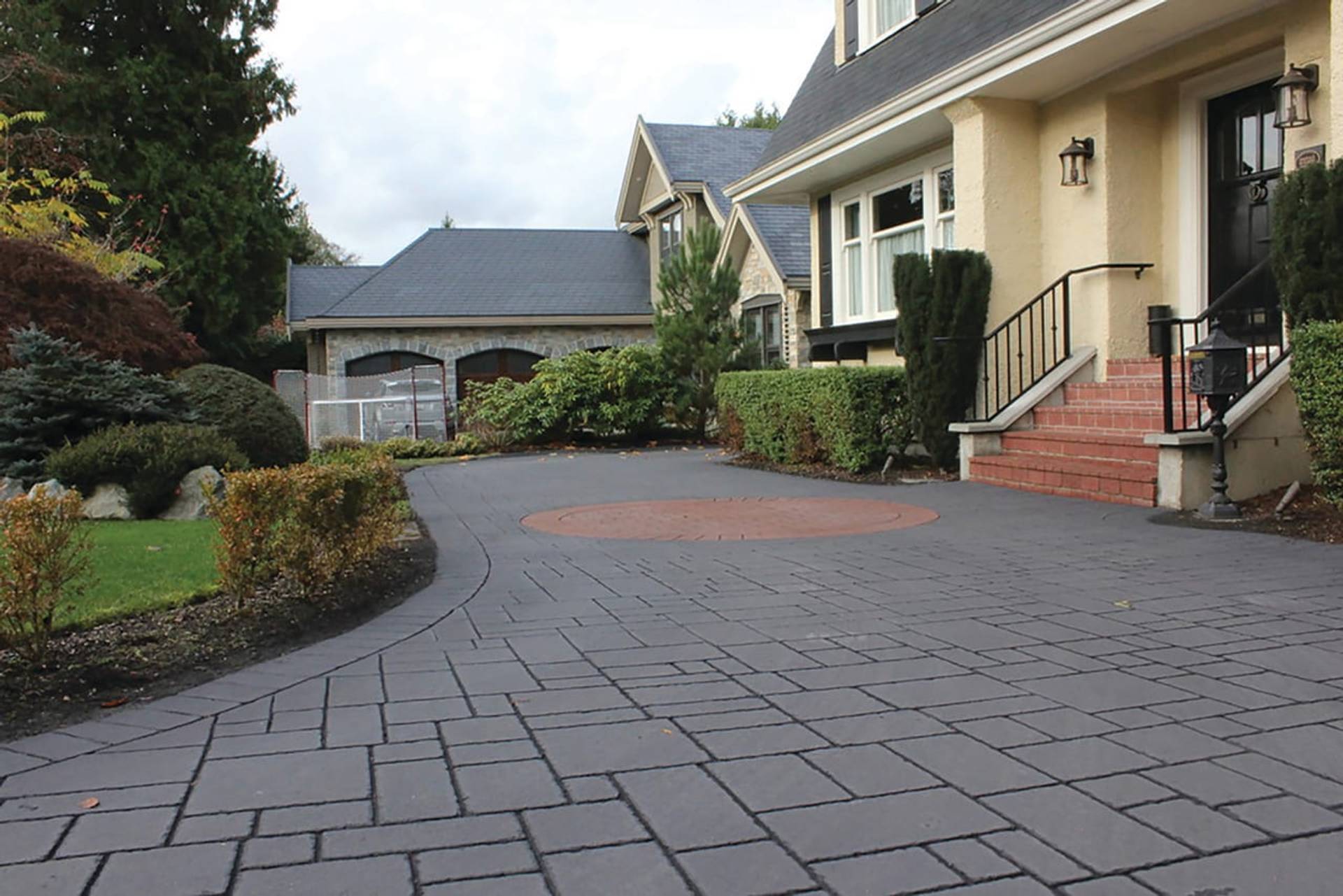 Stamped asphalt driveway at a suburban home in Canada, installed by HUB Surface Systems