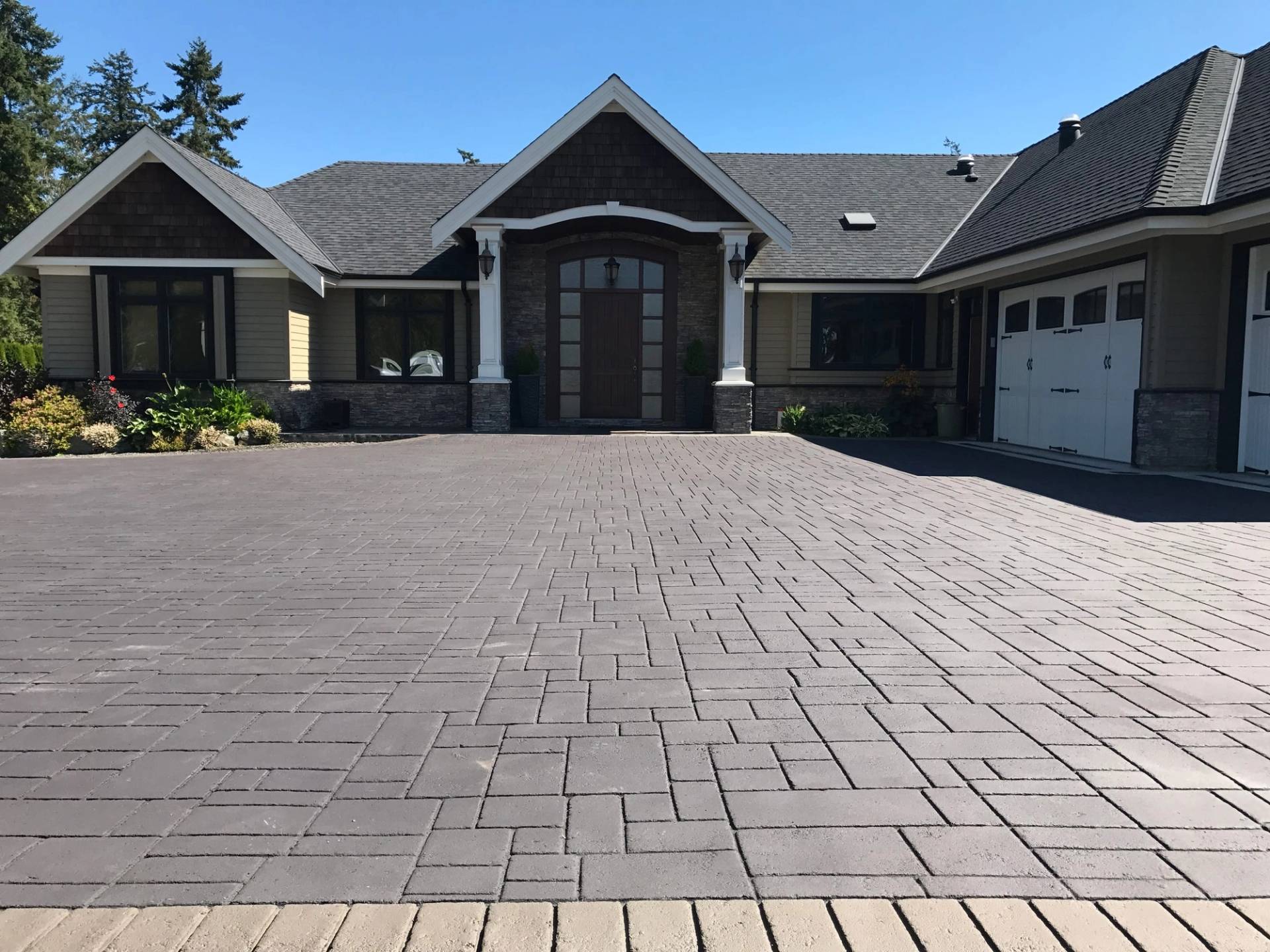 HUB Surface Systems StreetPrint stamped asphalt — brick and cobblestone appearance in asphalt at a park pathway