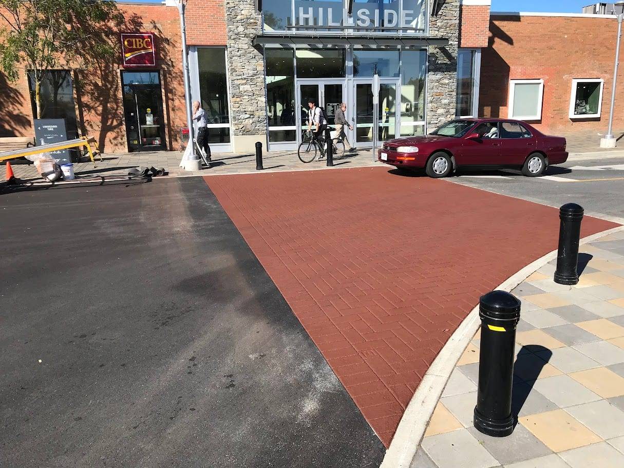 Commercial pavement design installation in Canada: retail entrances and commercial site identity at a shopping centre drive aisle