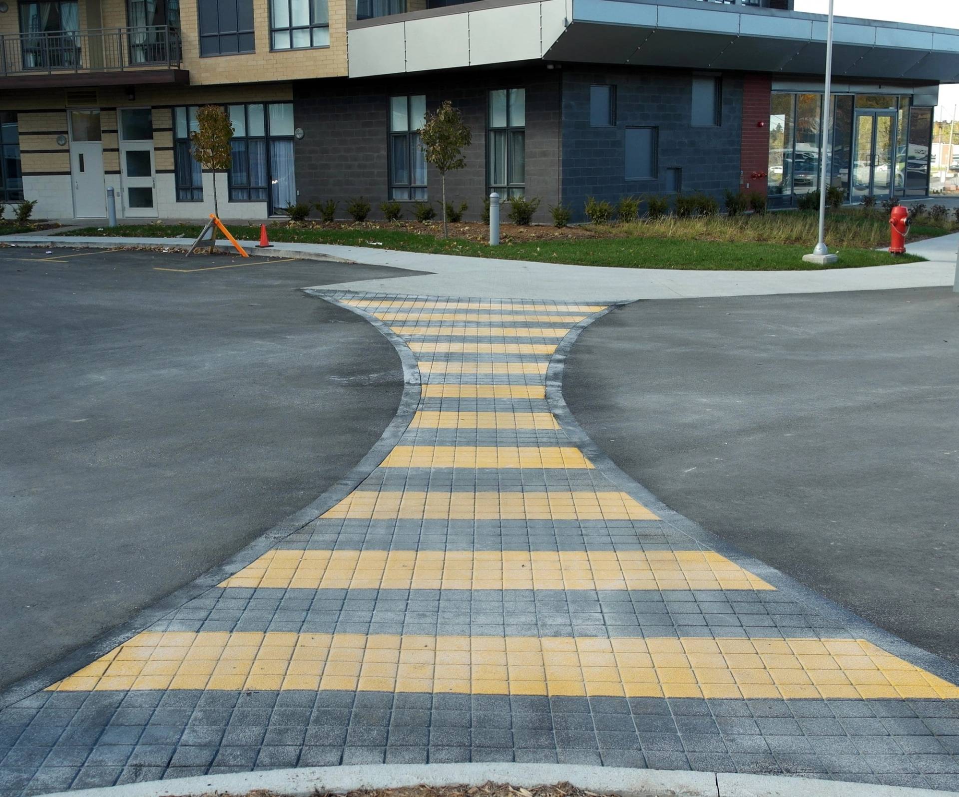 TrafficPatternsXD preformed thermoplastic specified for high-traffic decorative pavement with skid resistance at a high-volume crosswalk