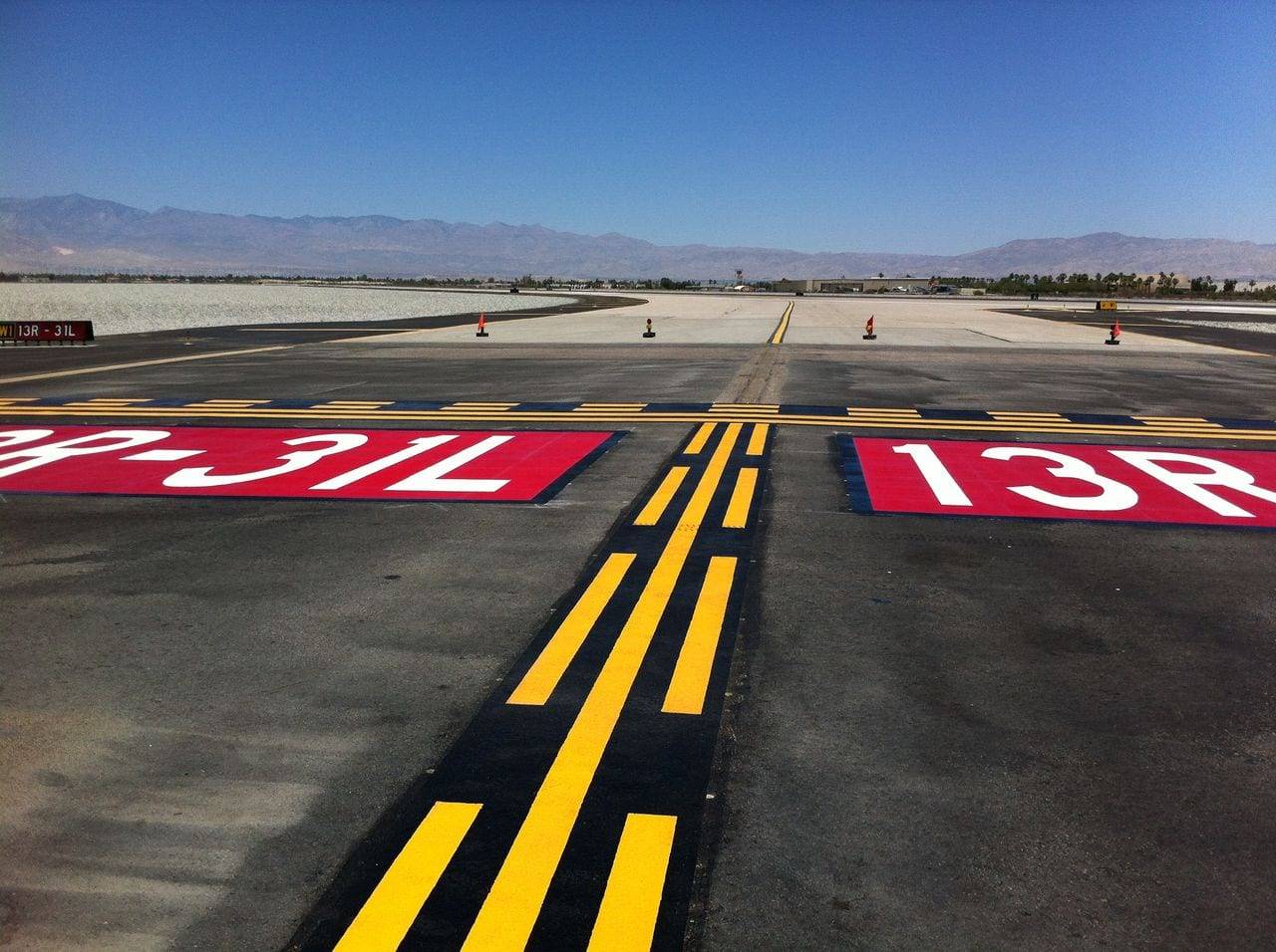 Airport pavement marking at an airside service road in Canada, installed by HUB Surface Systems