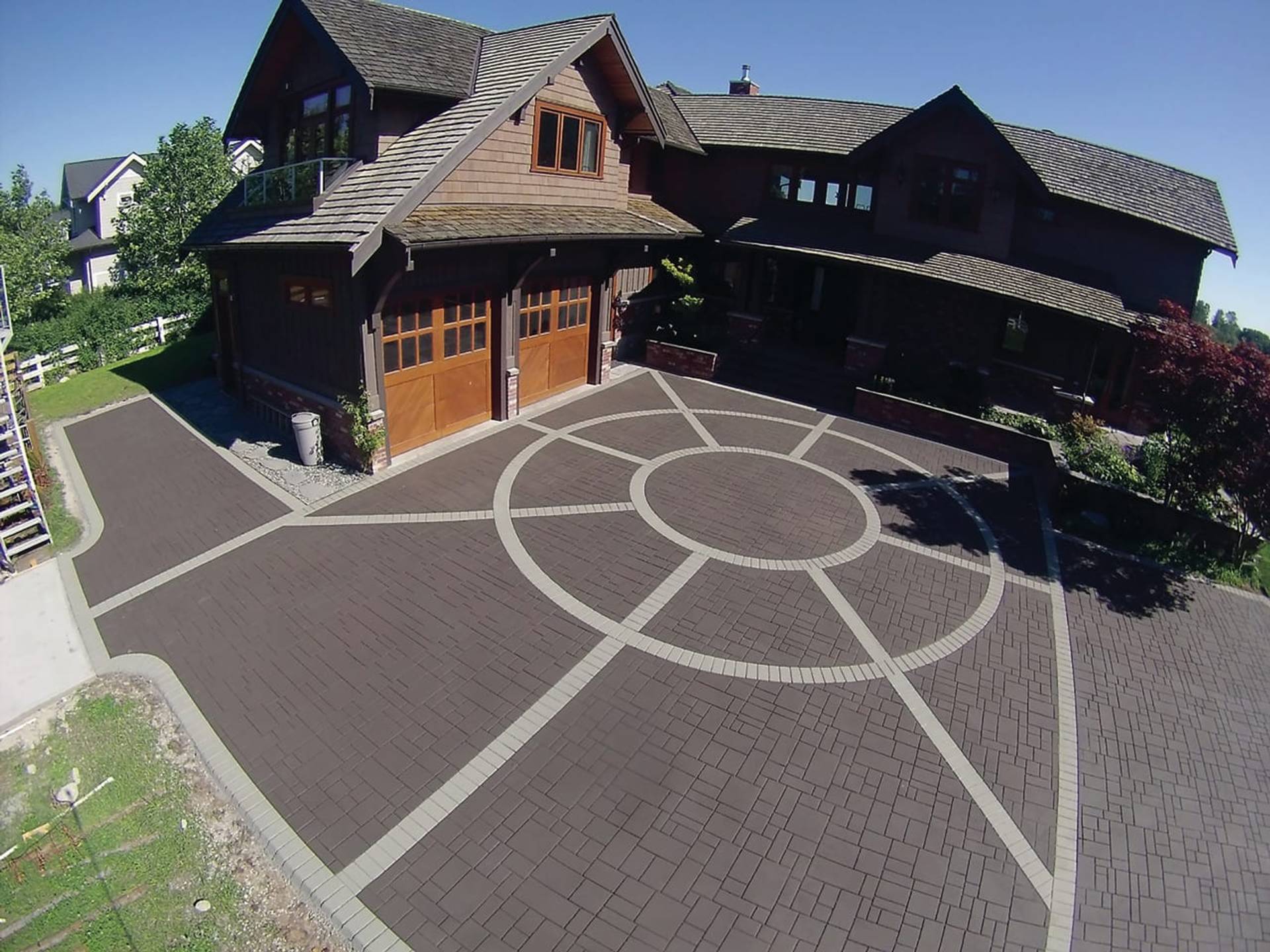Canadian stamped asphalt driveway project by HUB Surface Systems at a suburban home in Canada