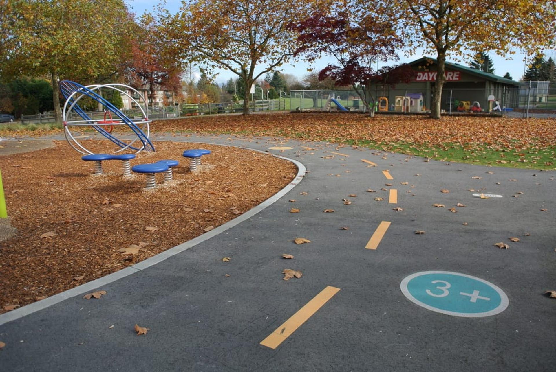 HUB Surface Systems decorative pathway paving — park pathways and public greenspace at a park entry plaza