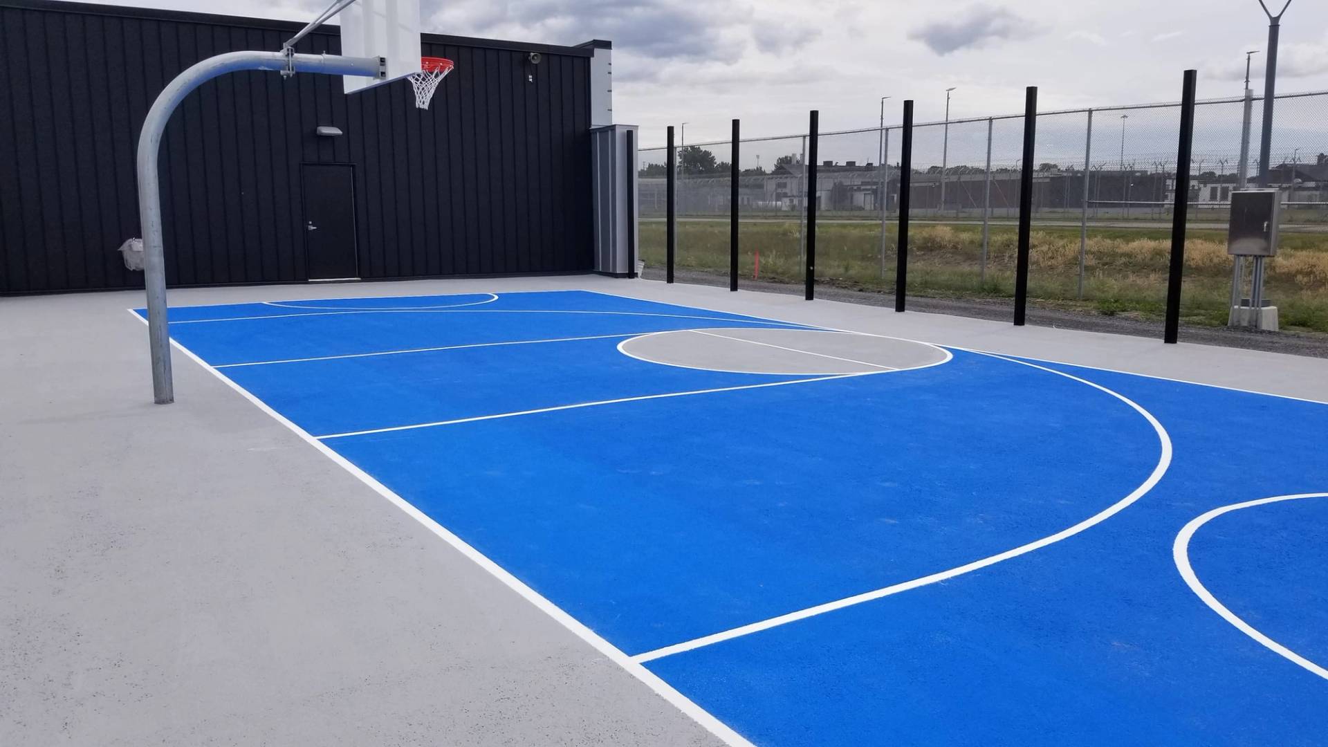 Sport court surfacing at a multi-sport pad in Canada, installed by HUB Surface Systems