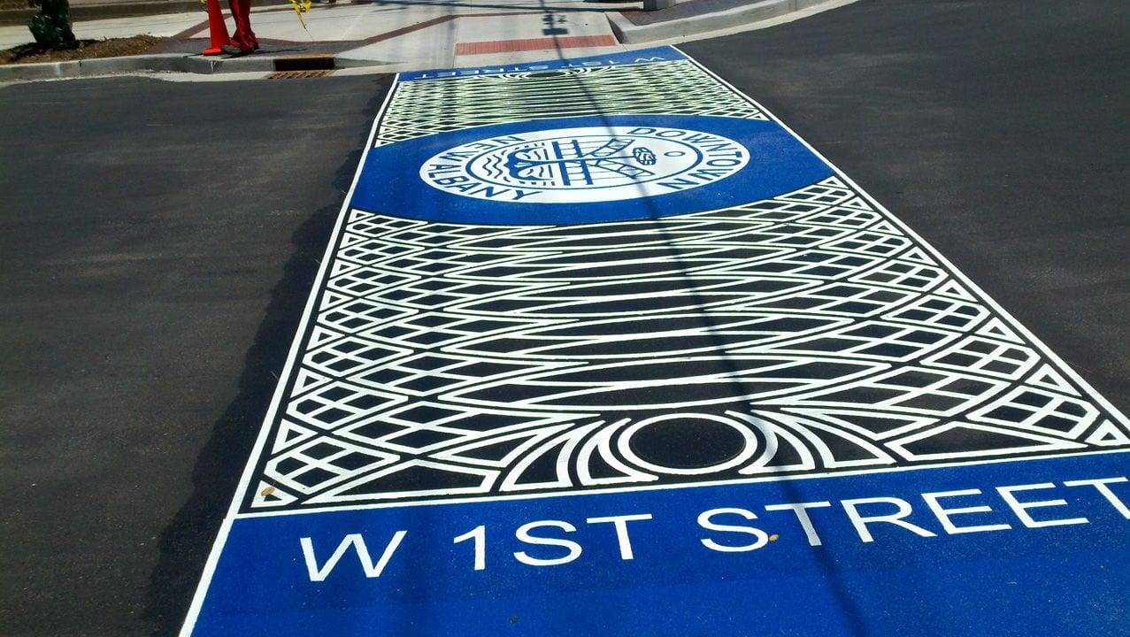 HUB Surface Systems commercial pavement design: retail entrances and commercial site identity at a shopping centre drive aisle