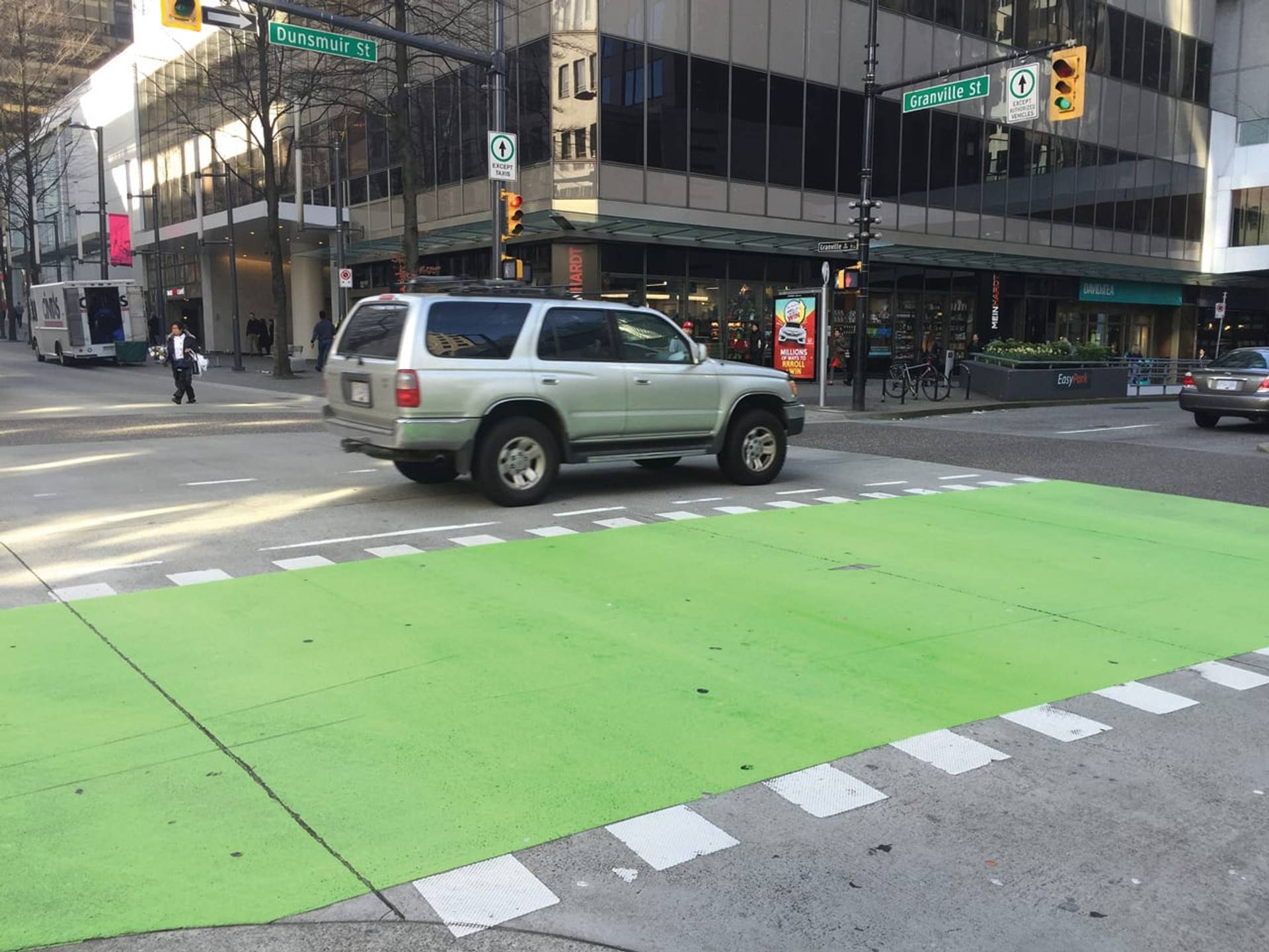 Coloured bike lane specified for protected cycling infrastructure at a multi-use path approach