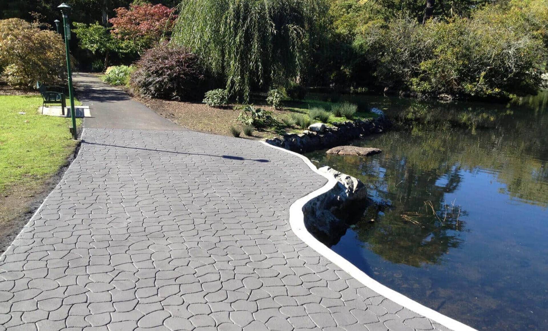 Canadian stamped asphalt driveway project by HUB Surface Systems at a residential street frontage in Canada
