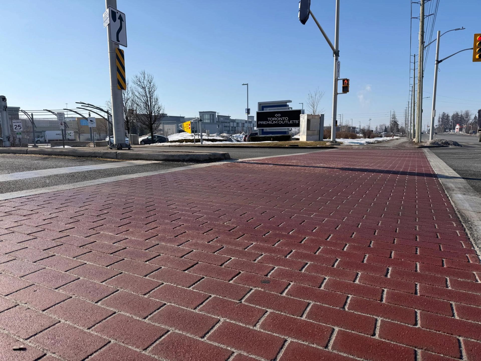 Red brick-pattern crosswalk at the entrance to Toronto Premium Outlets, Halton Hills, Ontario